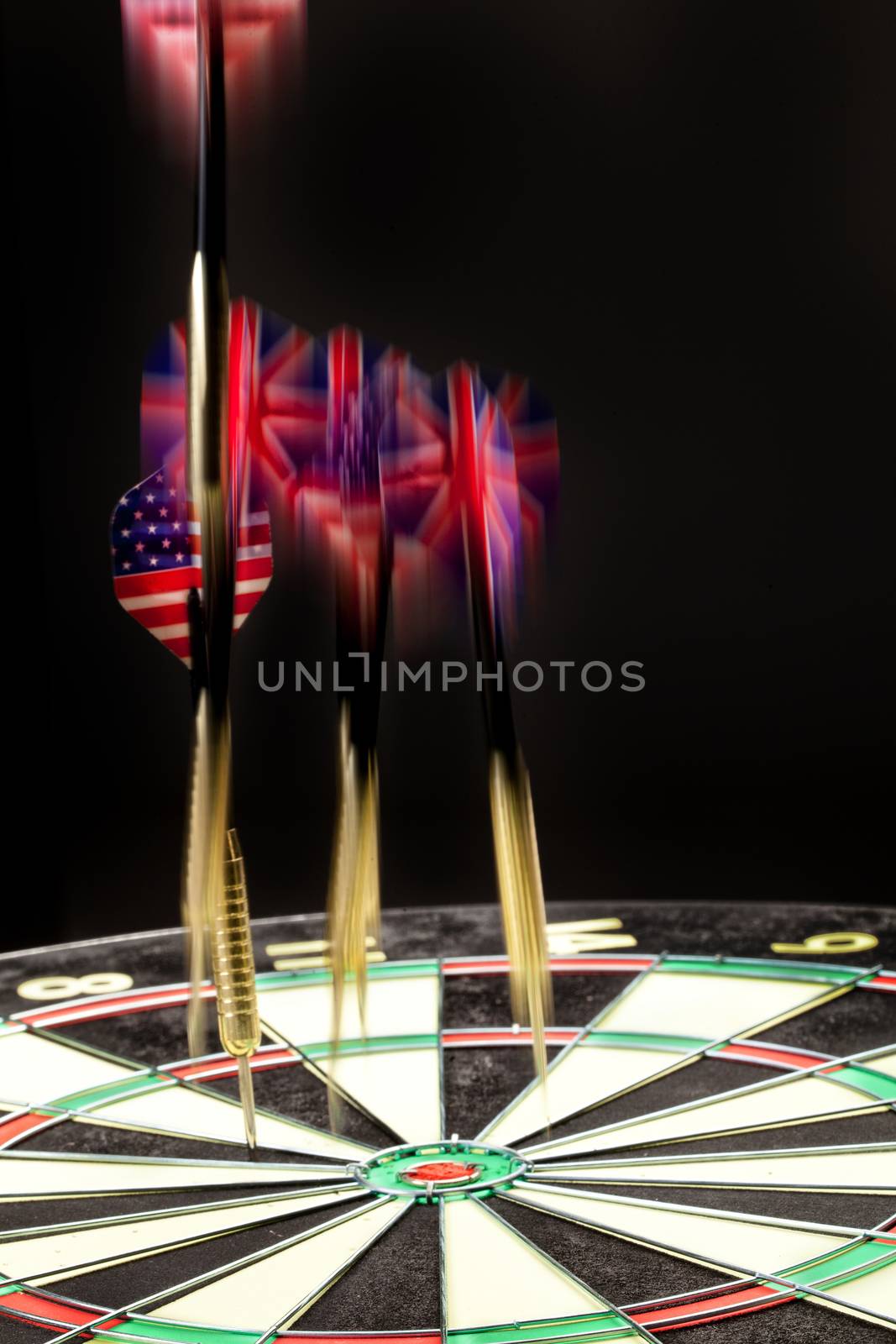 Indoor game Darts on a black studio background
