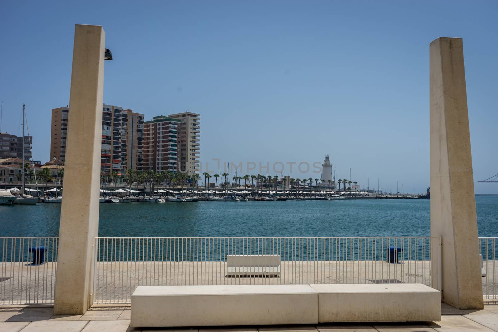 The sea and the lighthouse viewed through two pillars at Malaga, by ramana16