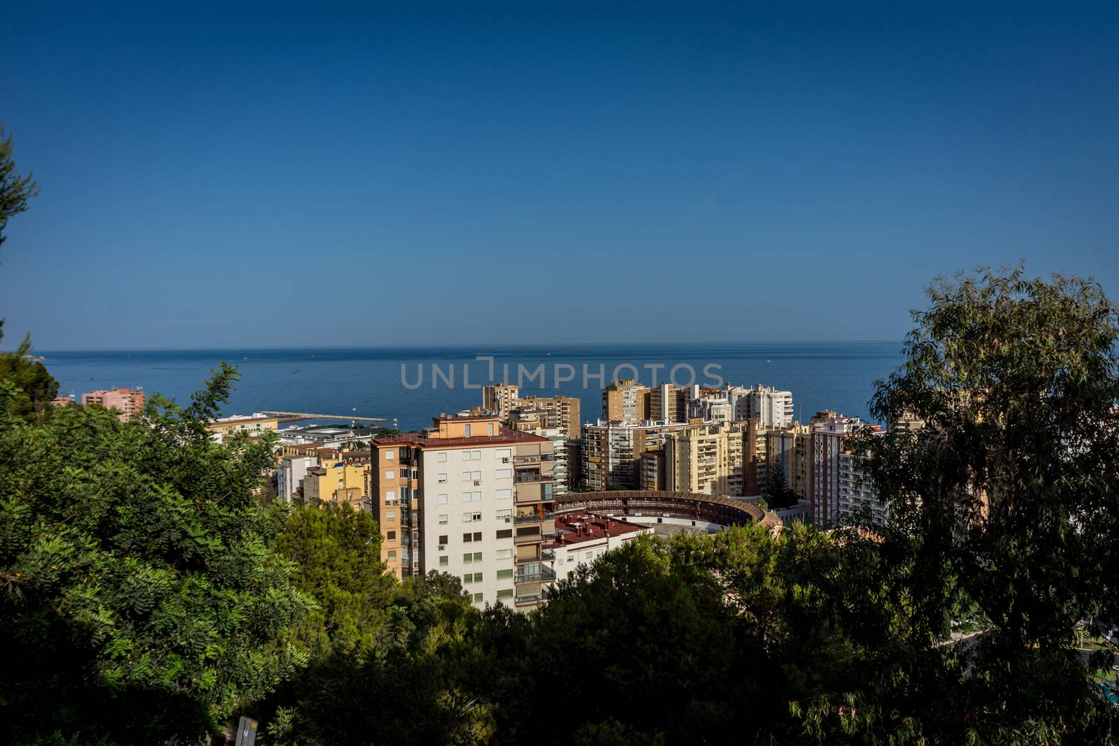 aerial view of Malagueta district and La Malagueta Bullring in Malaga, Spain, Europe on a bright summer day with blue sky