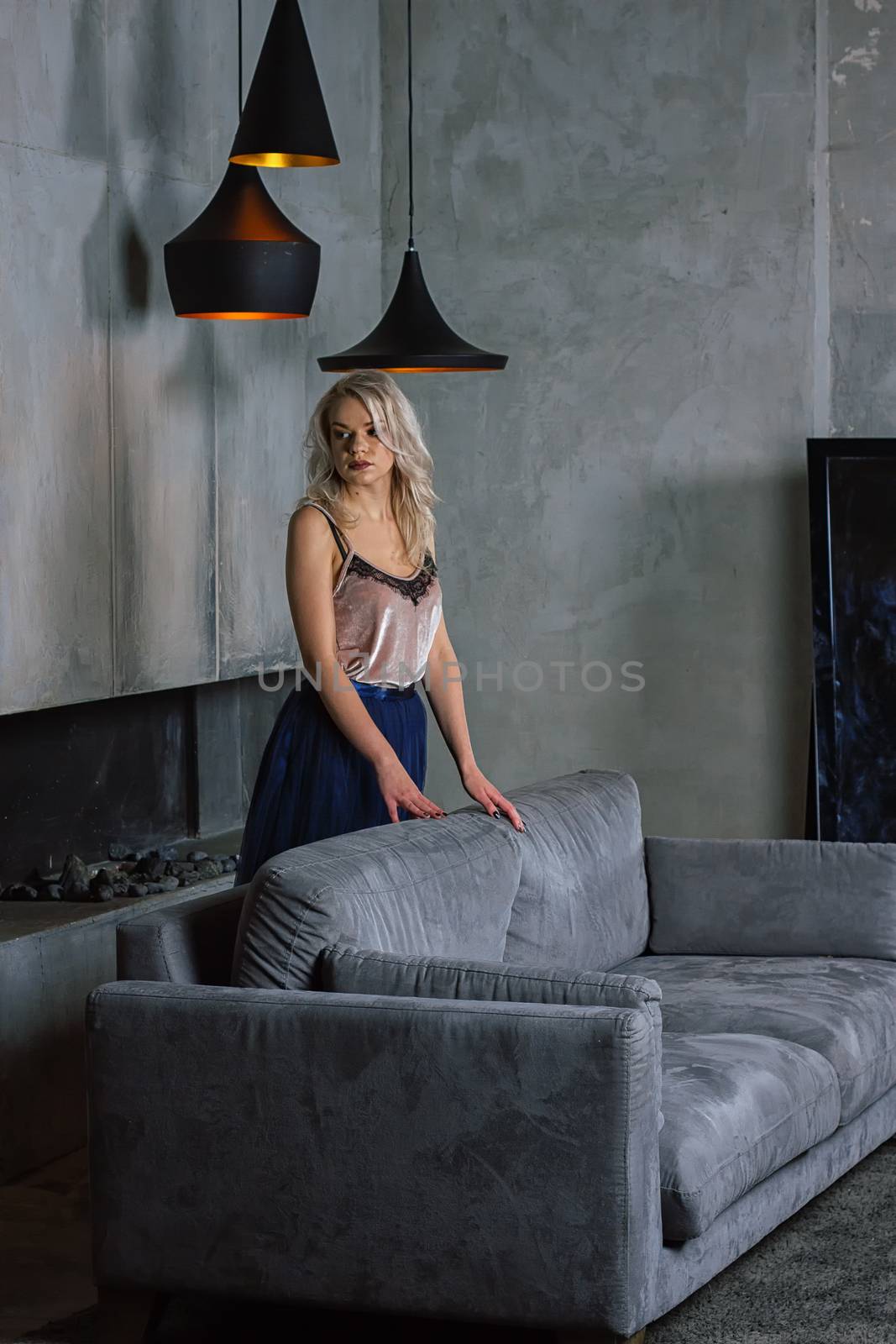 Young stunning sexy woman posing in loft lounge interior by victosha