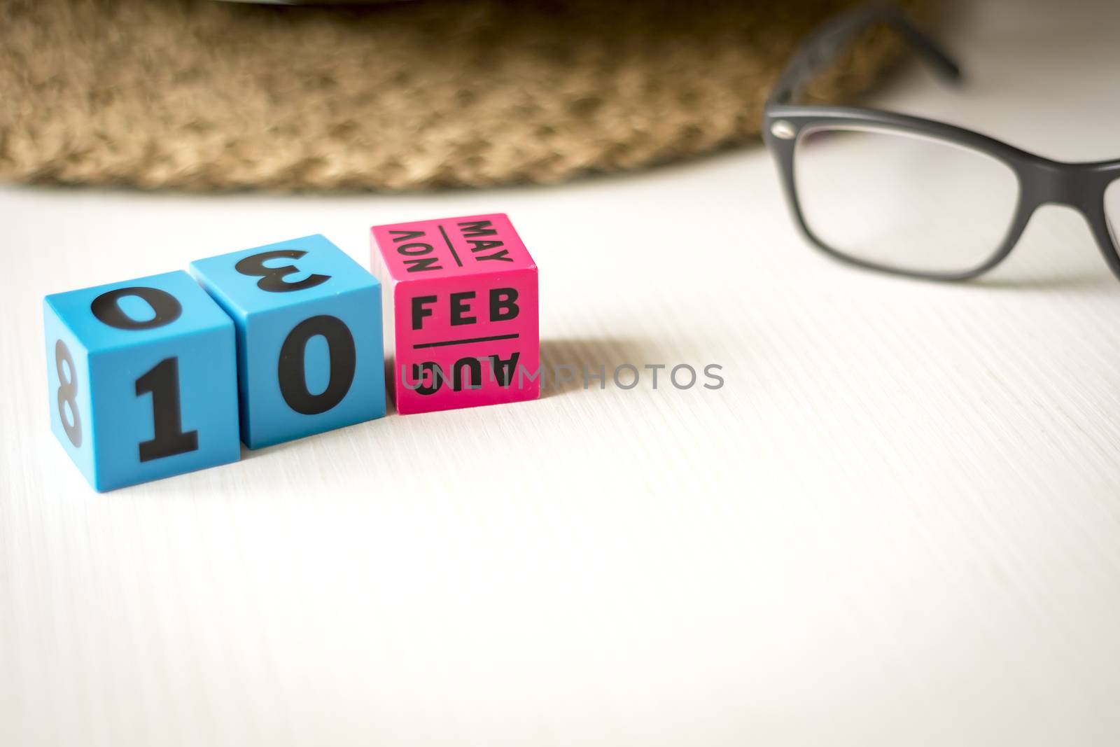 modern perpetual calendar composed of colored cubes and set at the date of February 10th