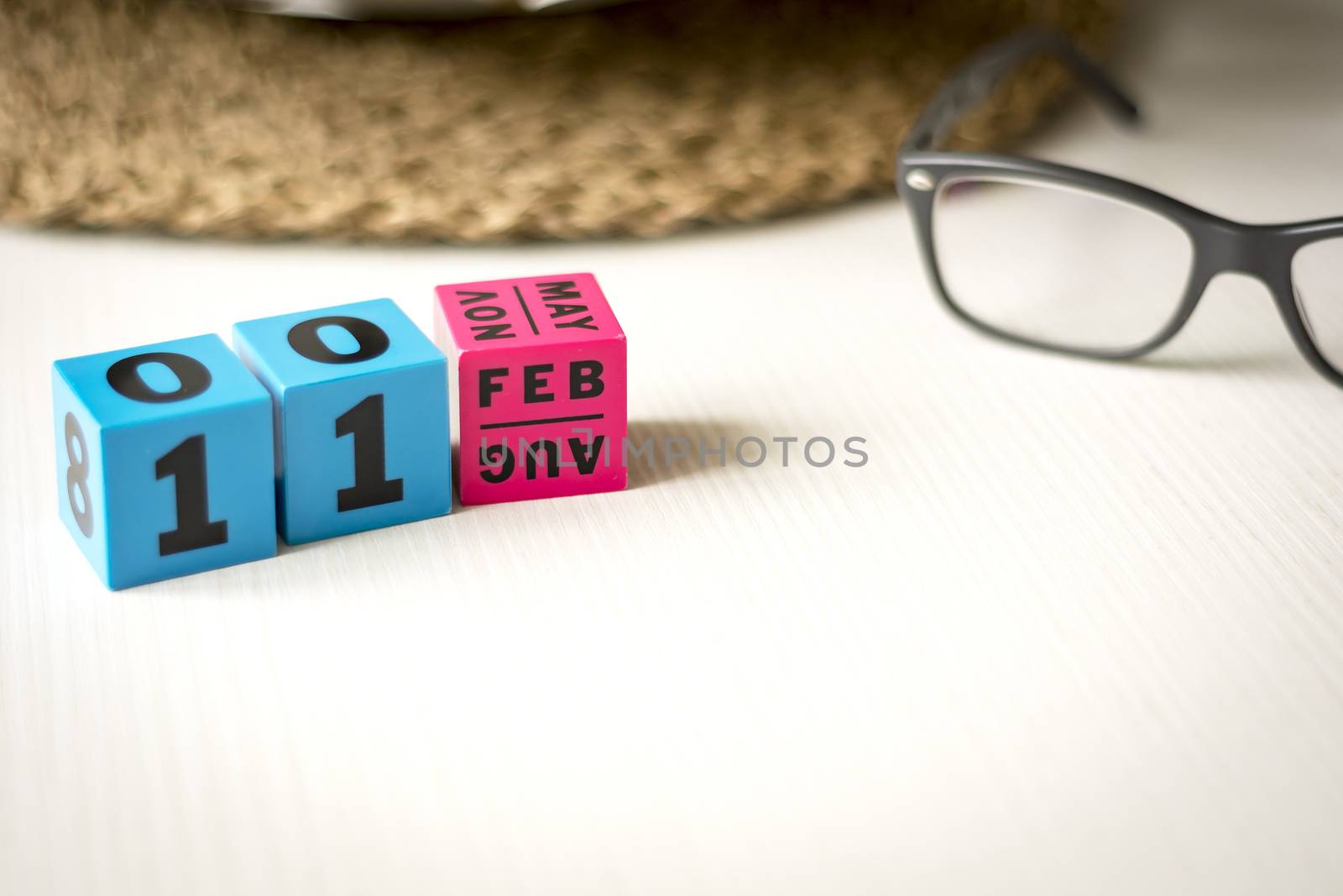 modern perpetual calendar composed of colored cubes and set at the date of February 11th