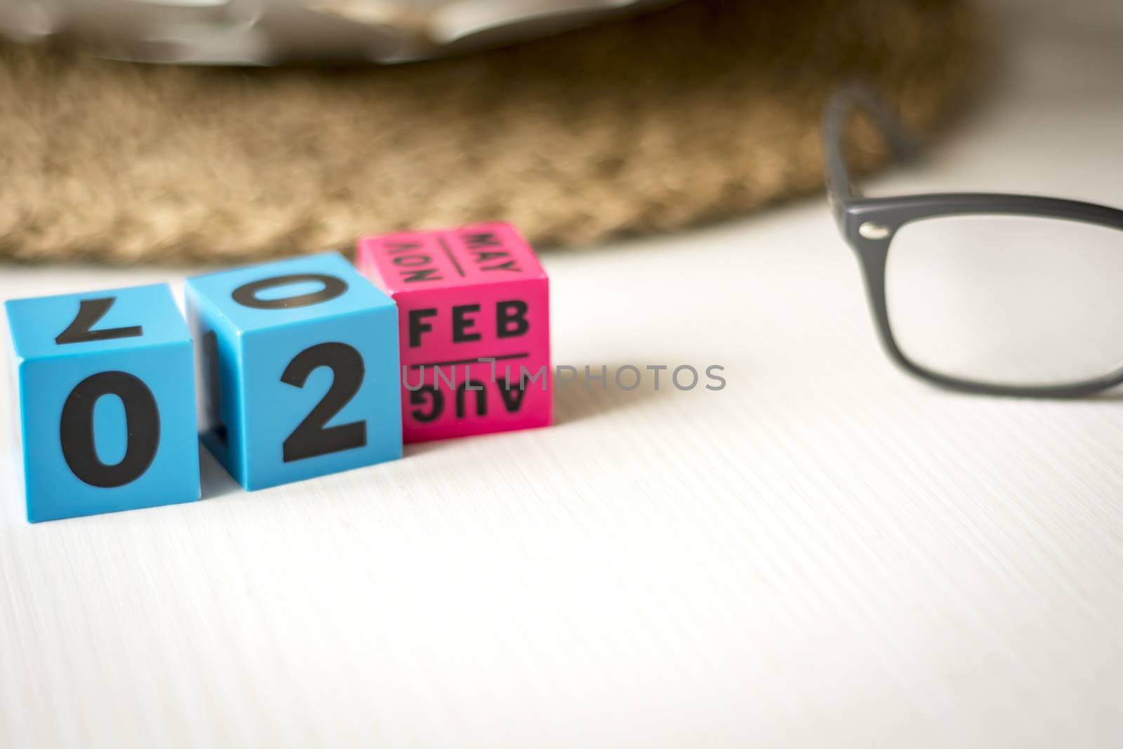 modern perpetual calendar composed of colored cubes and set at the date of February 2nd