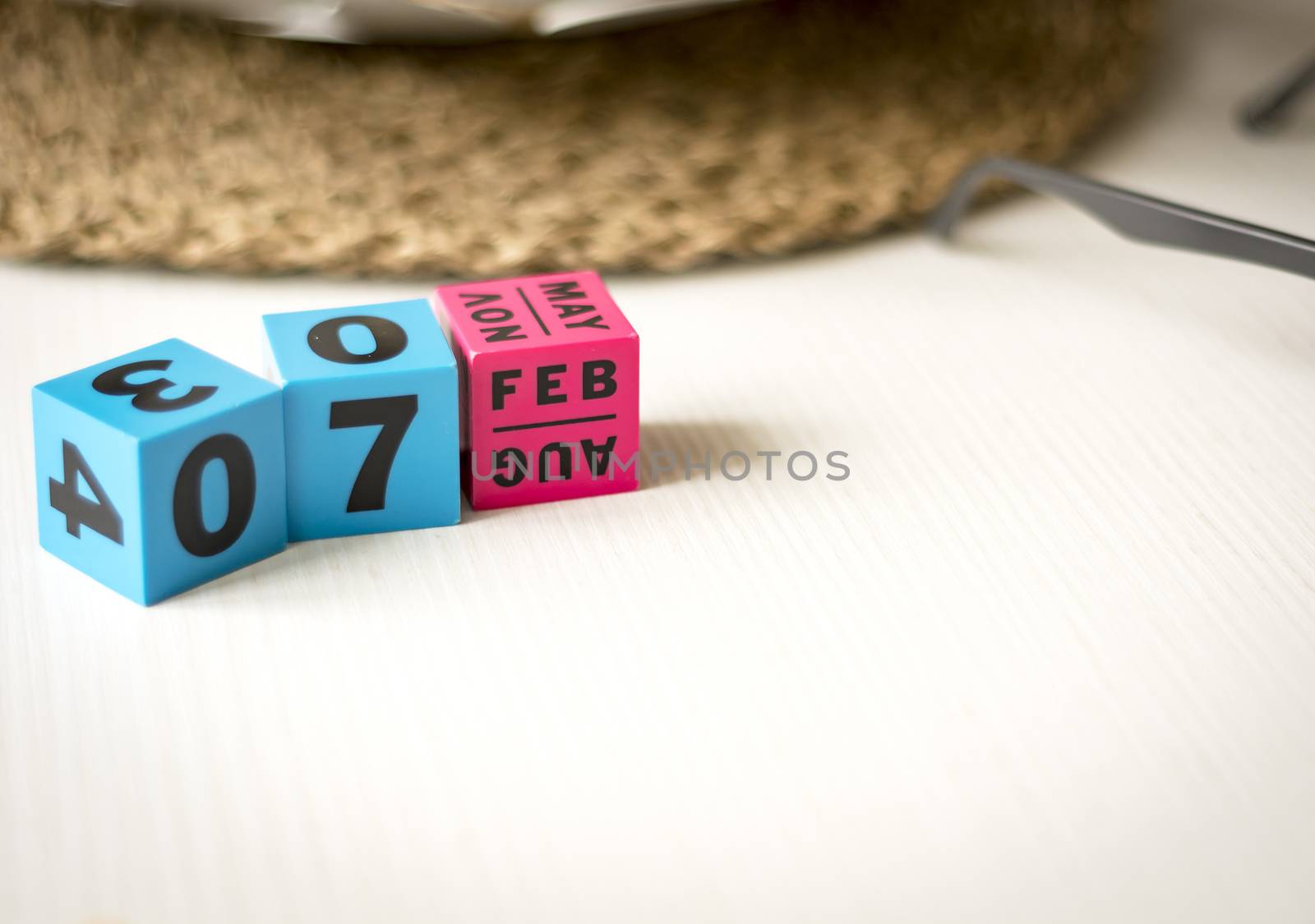 modern perpetual calendar composed of colored cubes and set at the date of February 7th