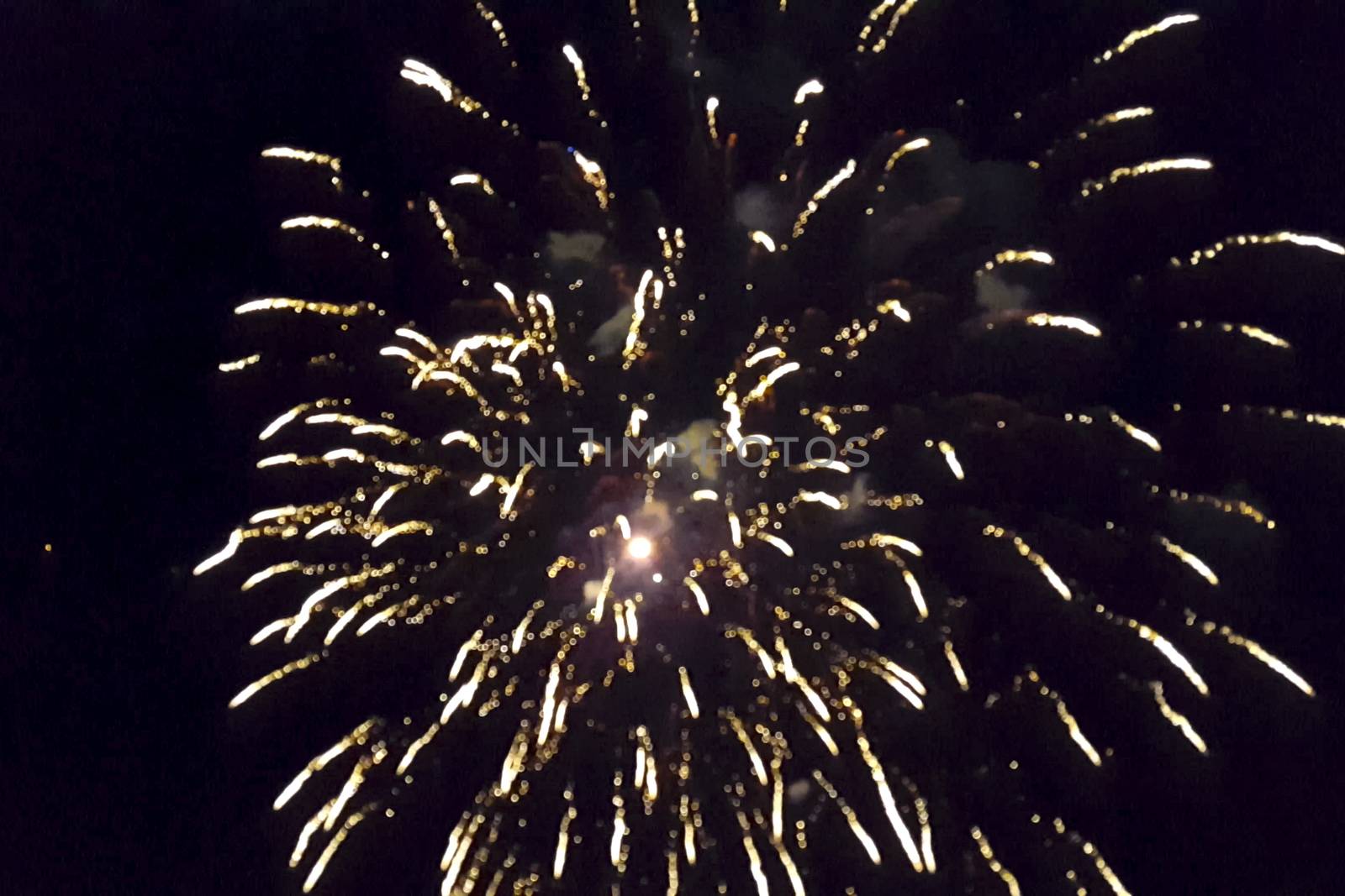 Festive salute in the night sky. Explosions of fireworks.