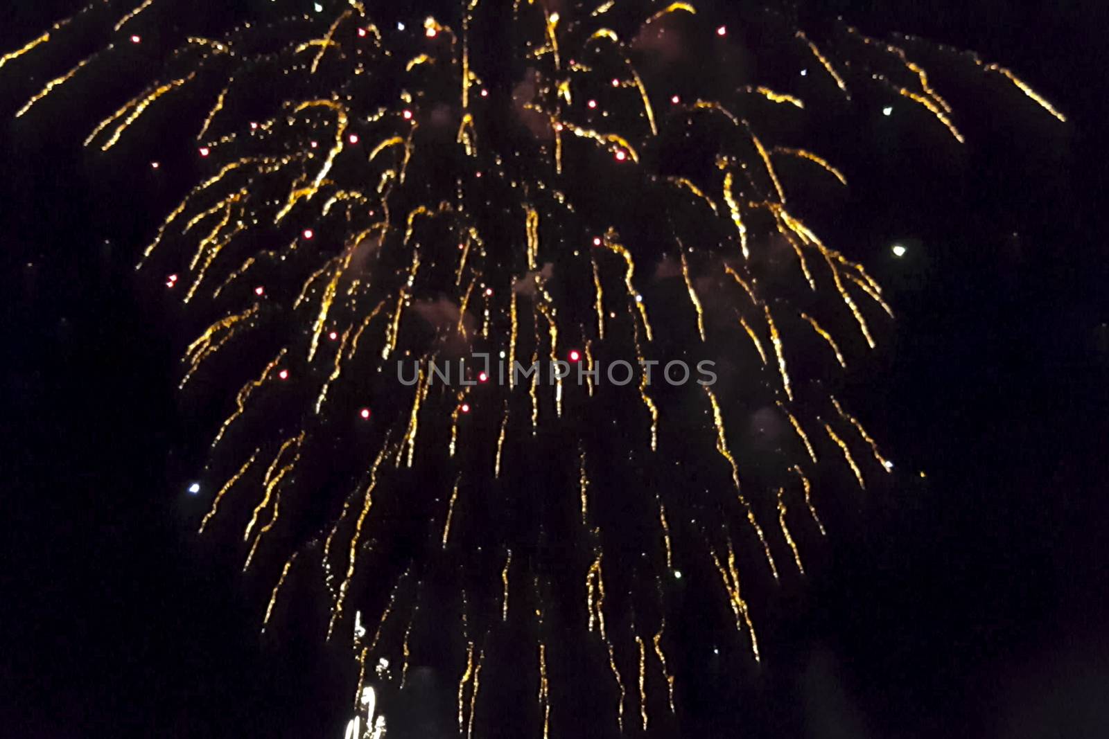 Festive salute in the night sky. Explosions of fireworks.
