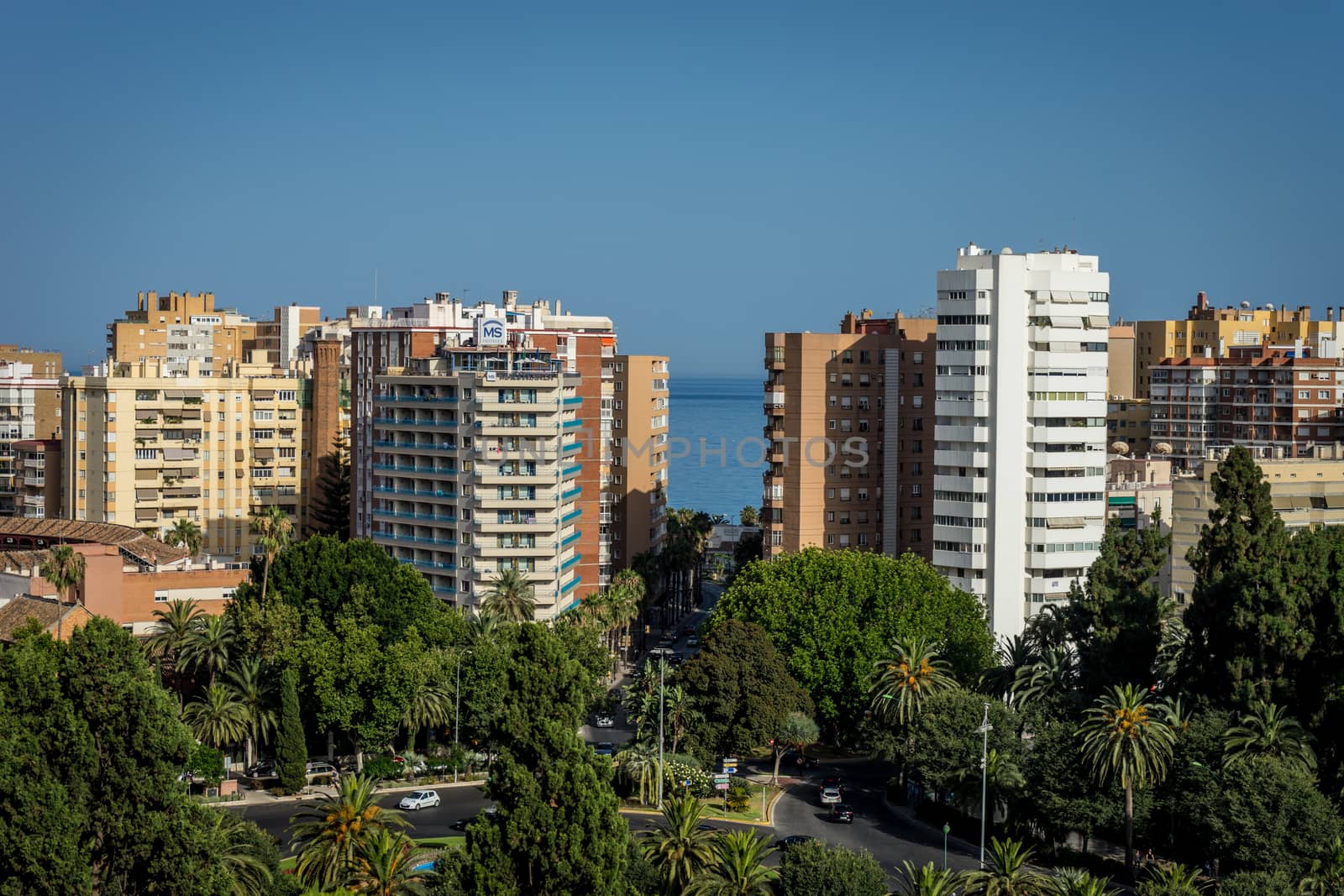 City skyline of Malaga overlooking the sea ocean in Malaga, Spain, Europe on a bright summer day with blue skies