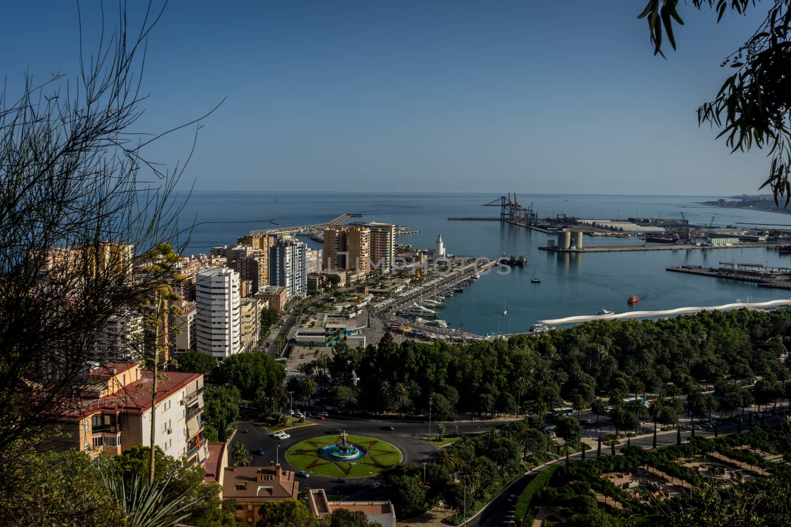 aerial view of Malagueta district and La Malagueta Harbour in Malaga, Spain, Europe on a bright summer day with blue sky