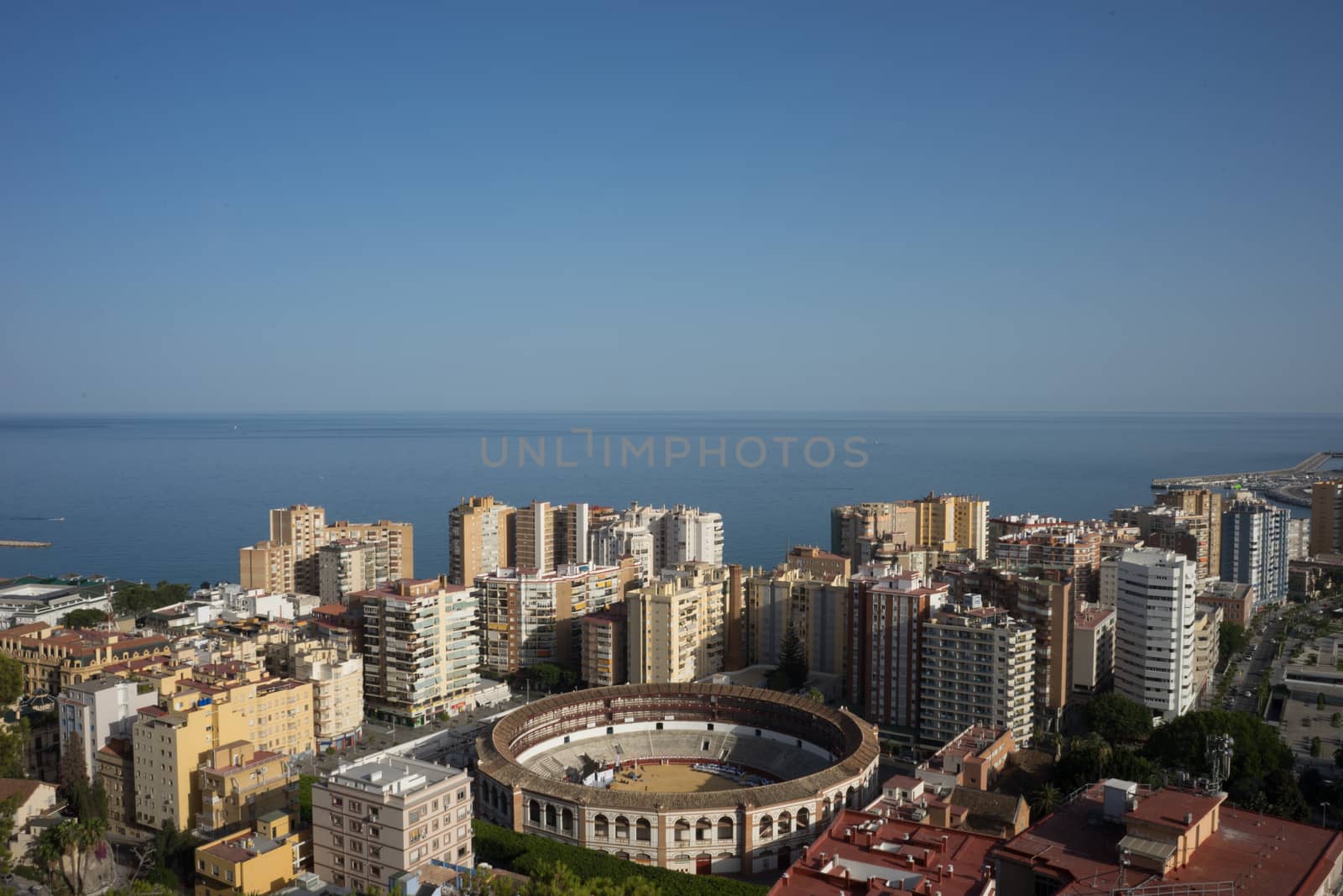 aerial view of Malagueta district and La Malagueta Bullring in Malaga, Spain, Europe on a bright summer day with blue sky