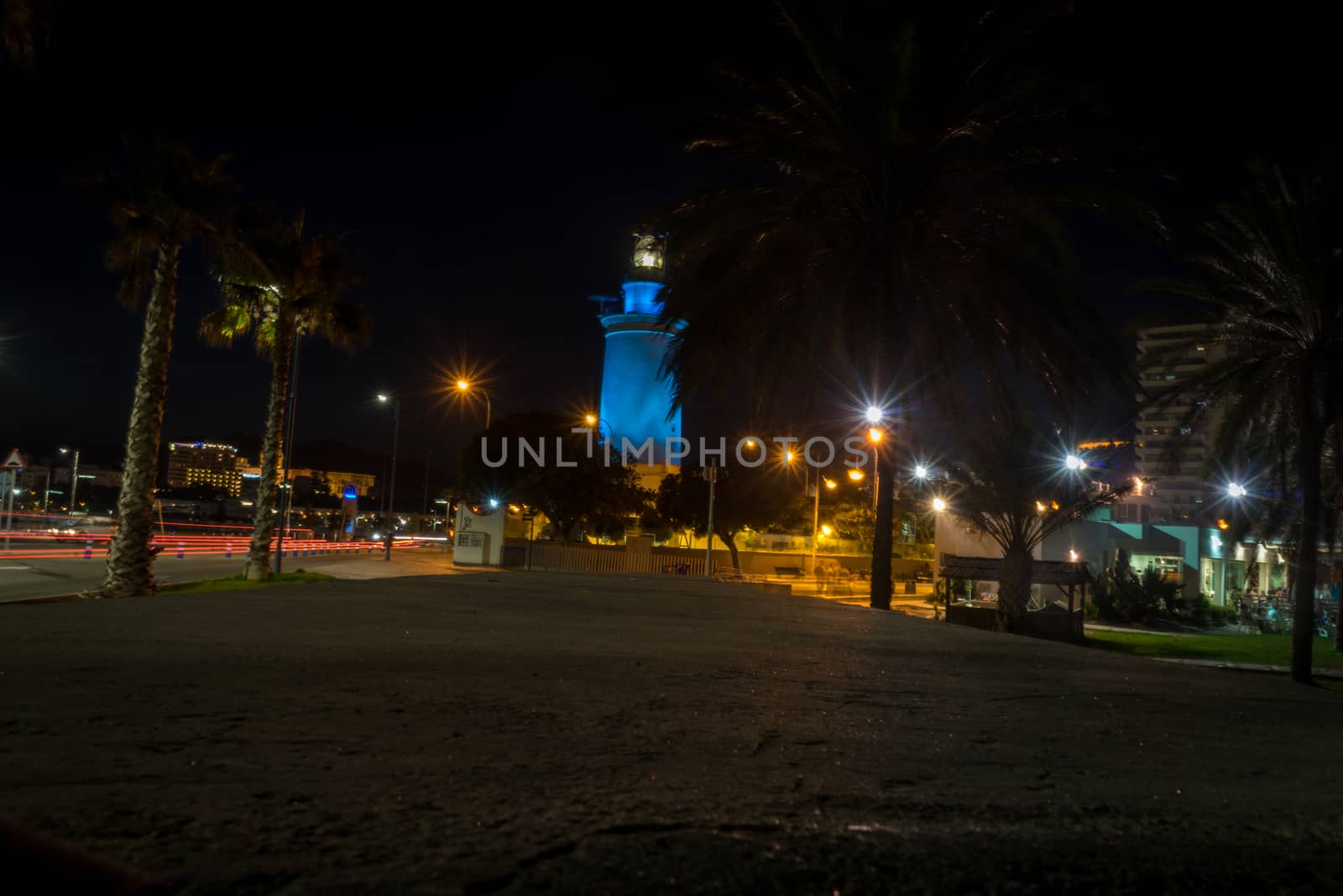 View of the white lighthouse of Malaga, Spain, Europe at night