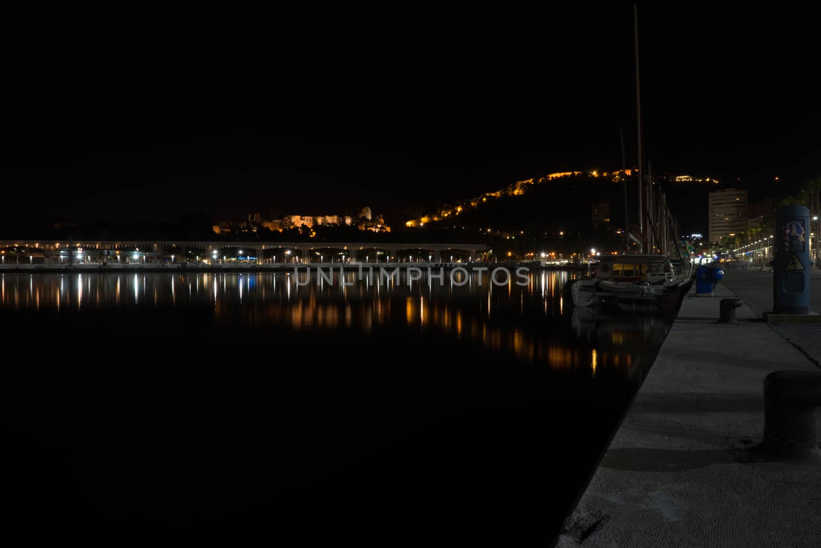 View of Alcazaba from harbour, Malaga, spain, Europe at night