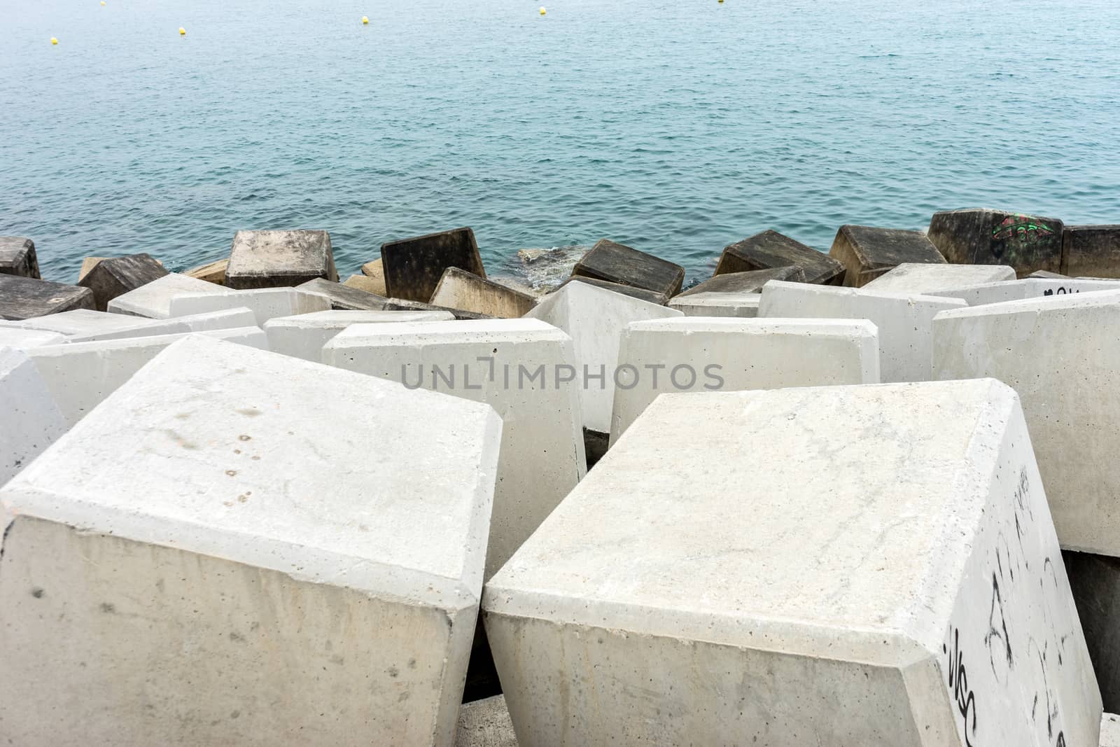 Stone along the Malagueta beach in Malaga, Spain, Europe on a foggy morning