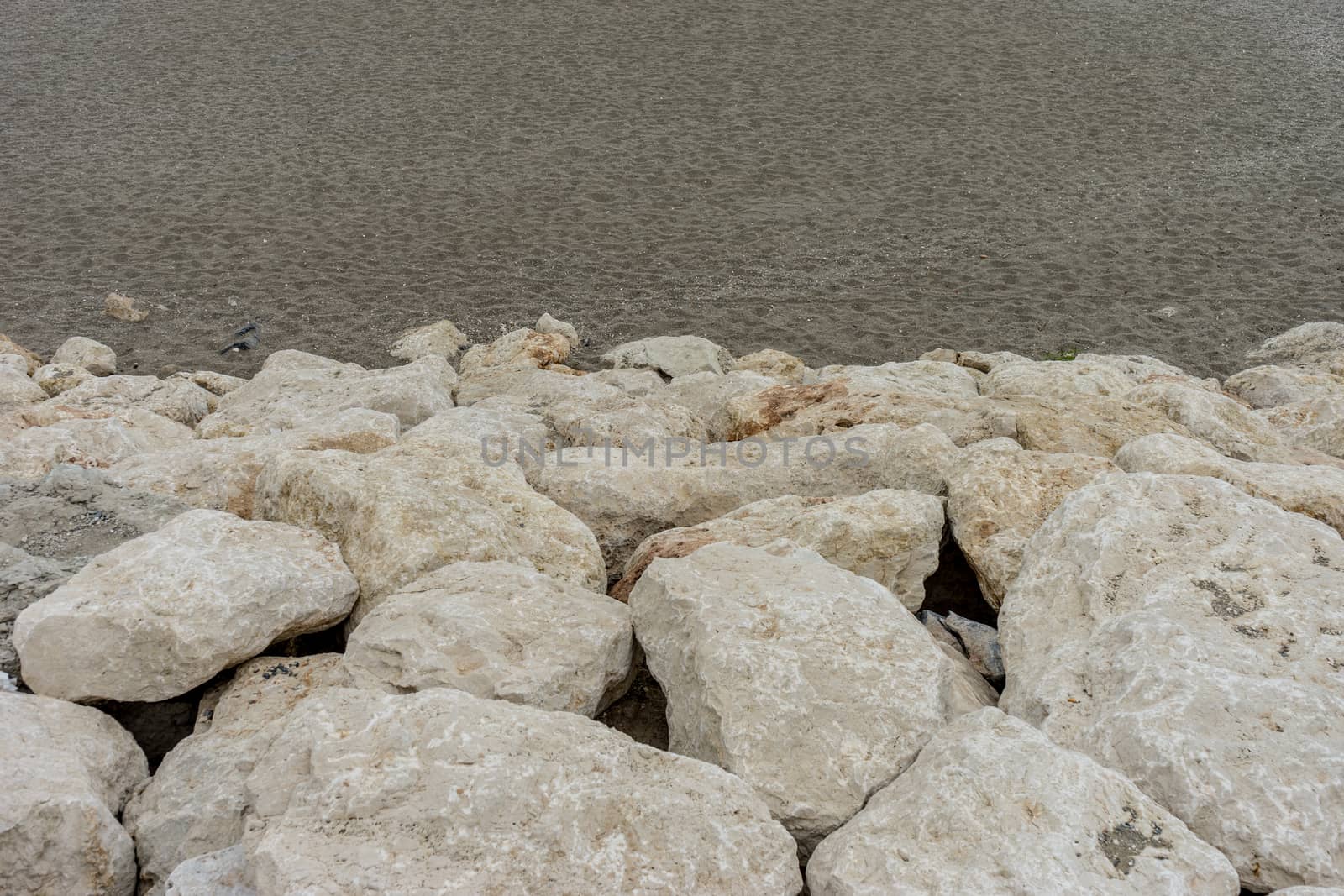 Stone along the Malagueta beach in Malaga, Spain, Europe on a foggy morning