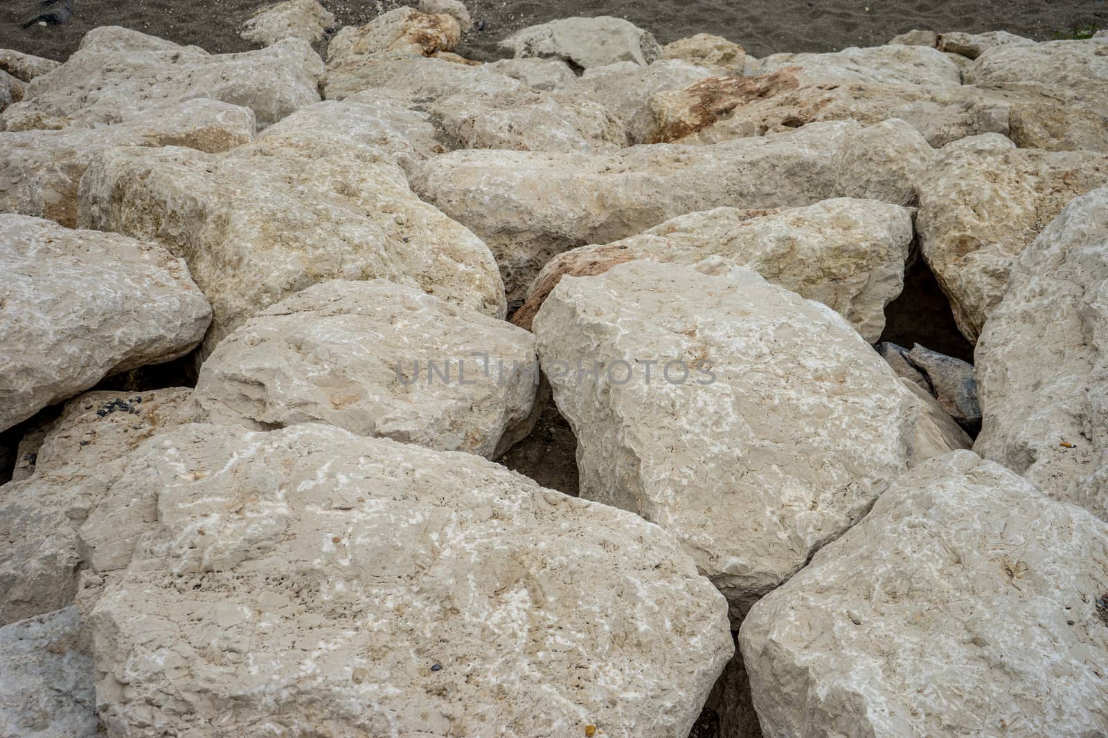 Stone along the Malagueta beach in Malaga, Spain, Europe on a foggy morning