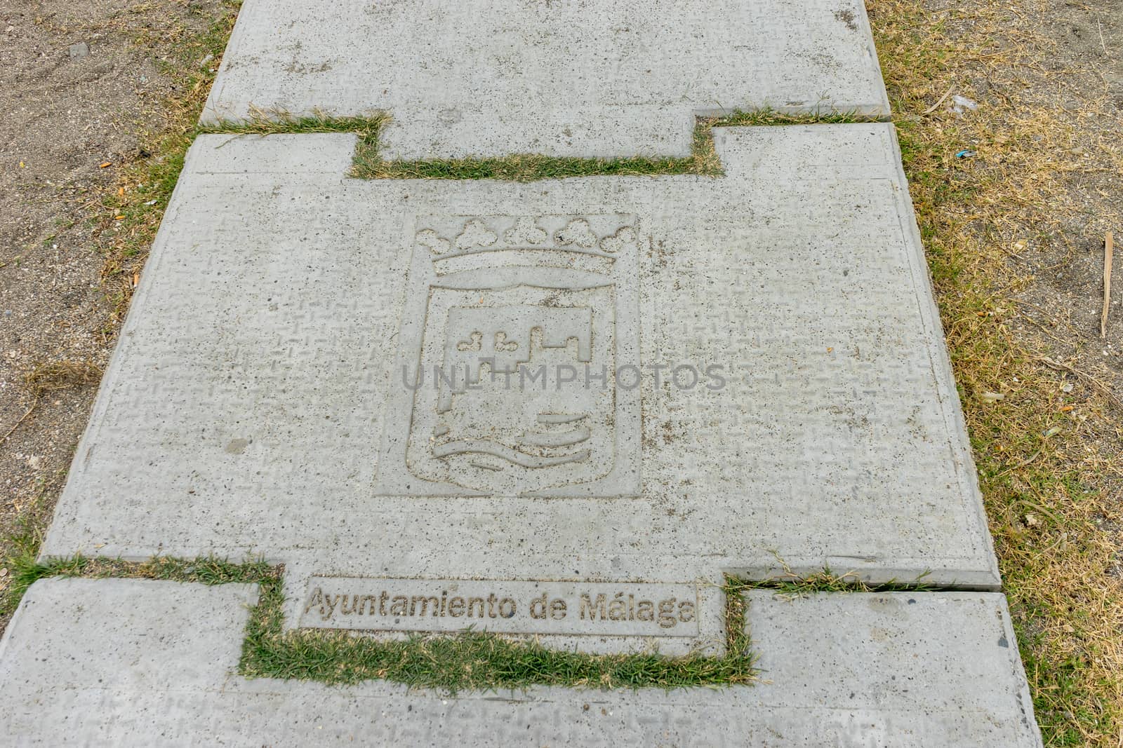 Inscription on a stone step at Malagueta beach in Malaga, Spain, Europe on a foggy morning