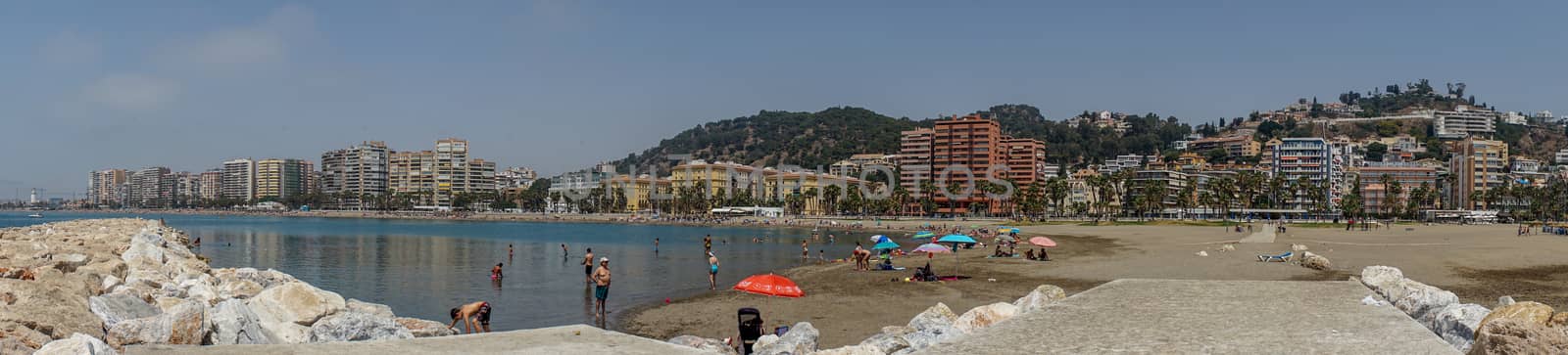 Panoramic view of the ocean at Malagueta beach with rocks at Mal by ramana16