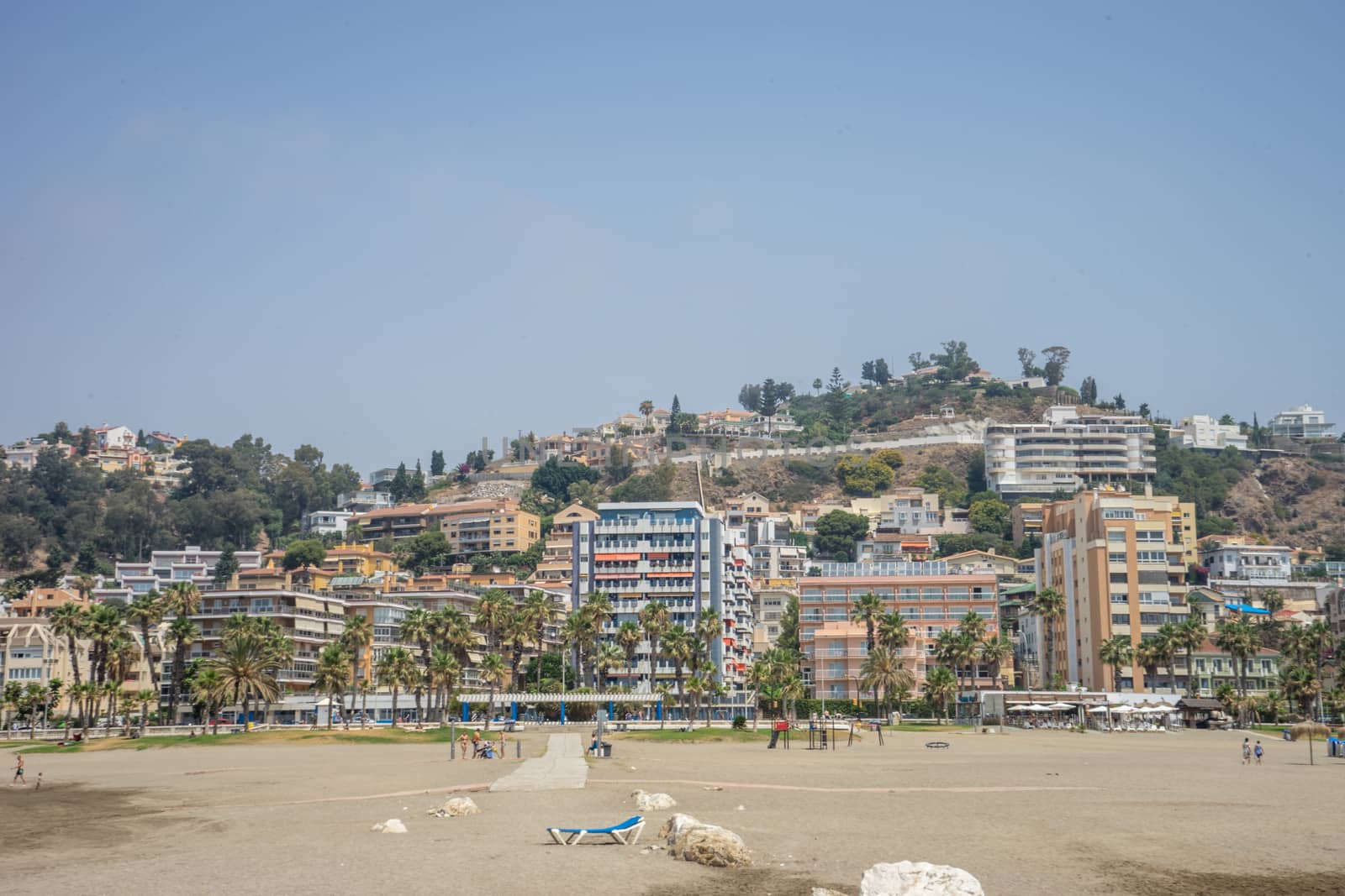 A hill overlooking the sandy Malagueta beach at Malaga, Spain, Europe on a cloudy morning