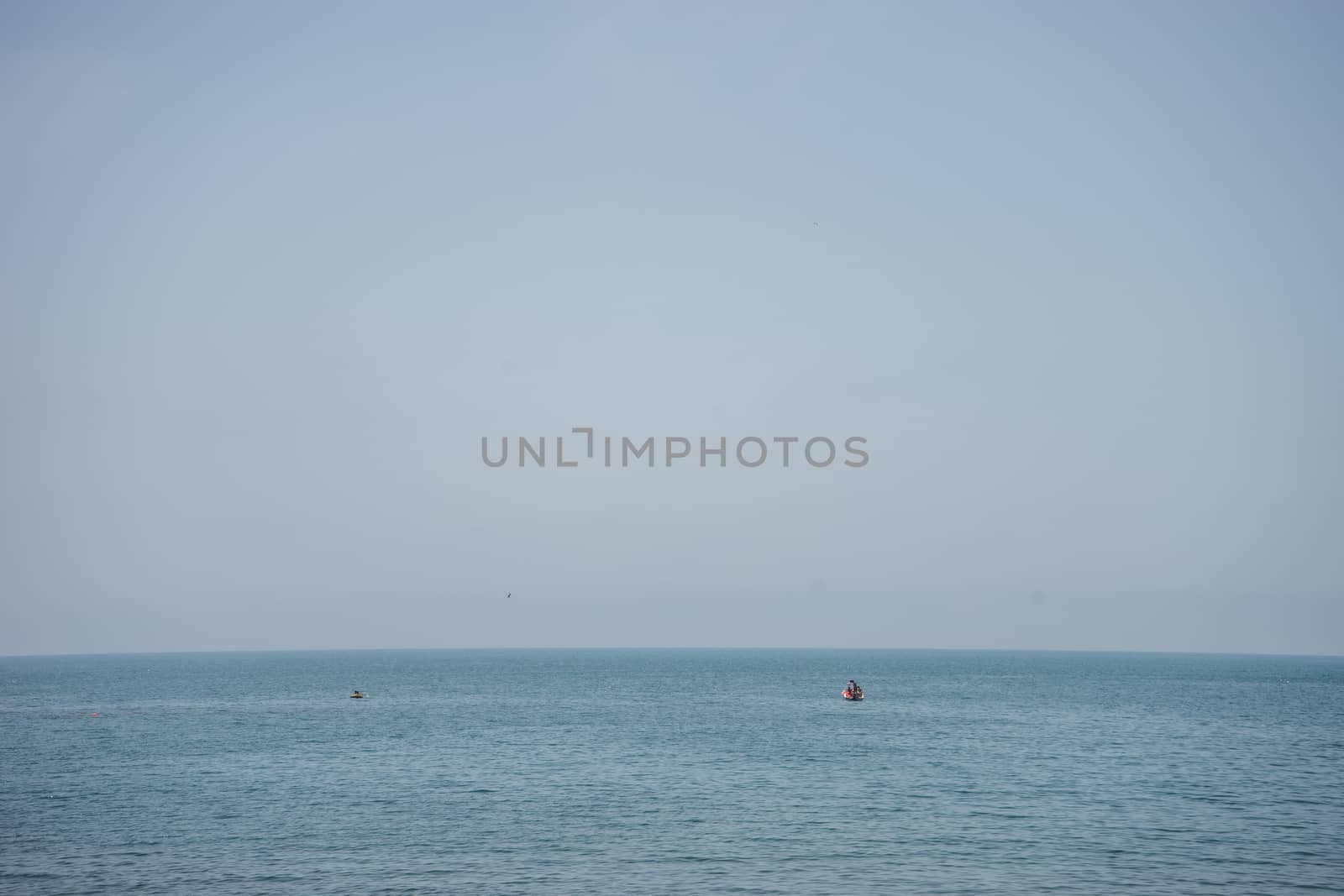 Calm and serene ocean  with a lonely boat at Malaga, Spain, Europe with clear sky and morning vibe