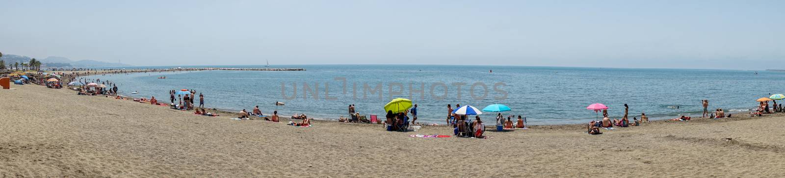 Panoramic view of the ocean at Malagueta beach with sand at Malaga, Spain, Europe on a clear sky morning