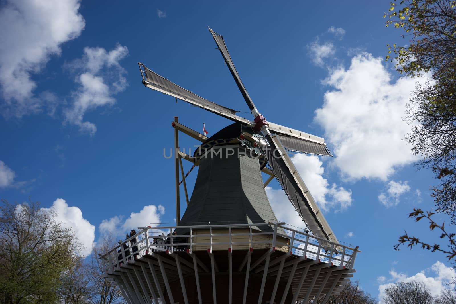 Ancient Dutch Windmill with a blue sky background in Lisse, Netherlands, Europe on a bright summer day