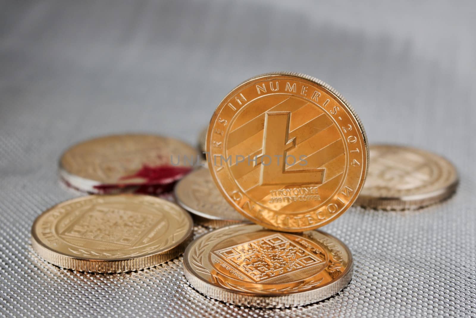 Digital currency physical gold litecoin coin on the gold bitcoin coins.