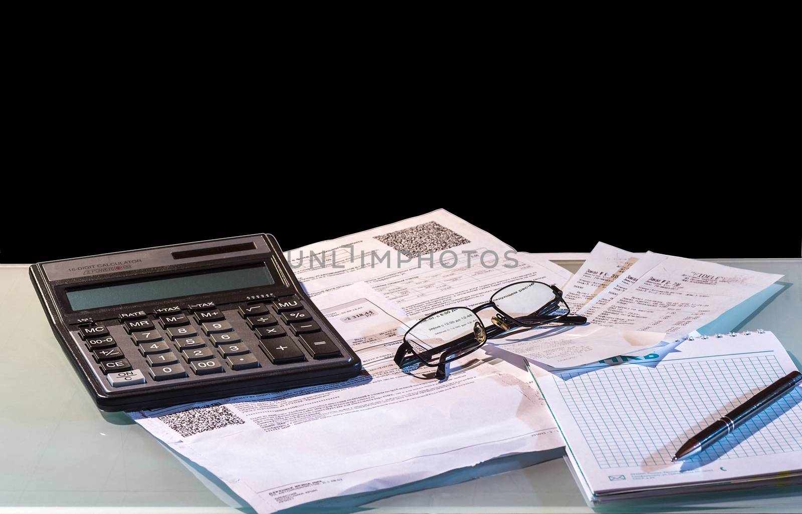 still life showing someone is leading household finances using a calculator