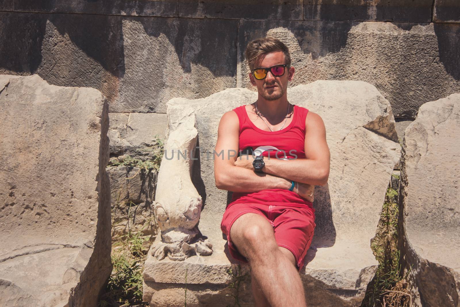 Young man at theatre in Myra ancient city of Antalya in Turkey.