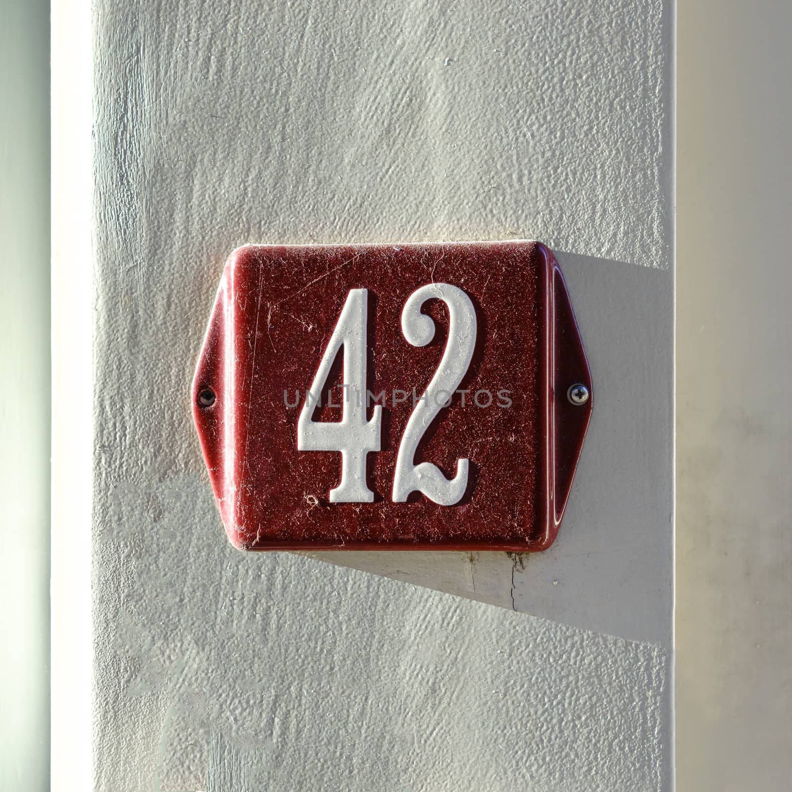 Enameled house number forty two (42)