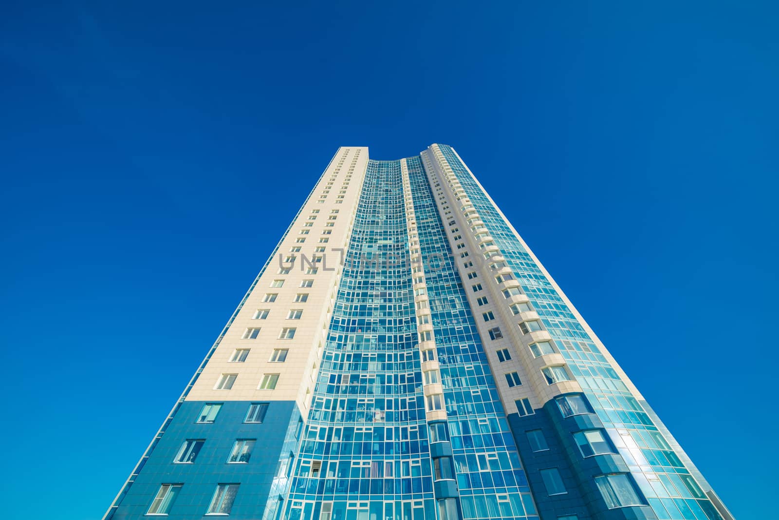 Modern building exterior low angle view with blue sky