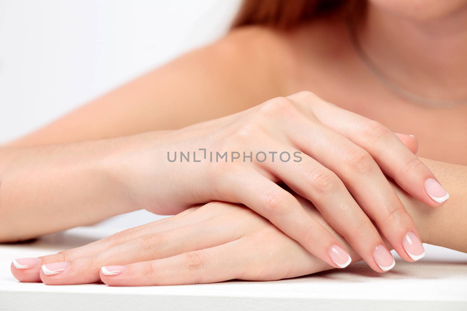 Closeup shot of beautiful female hands with long fingers