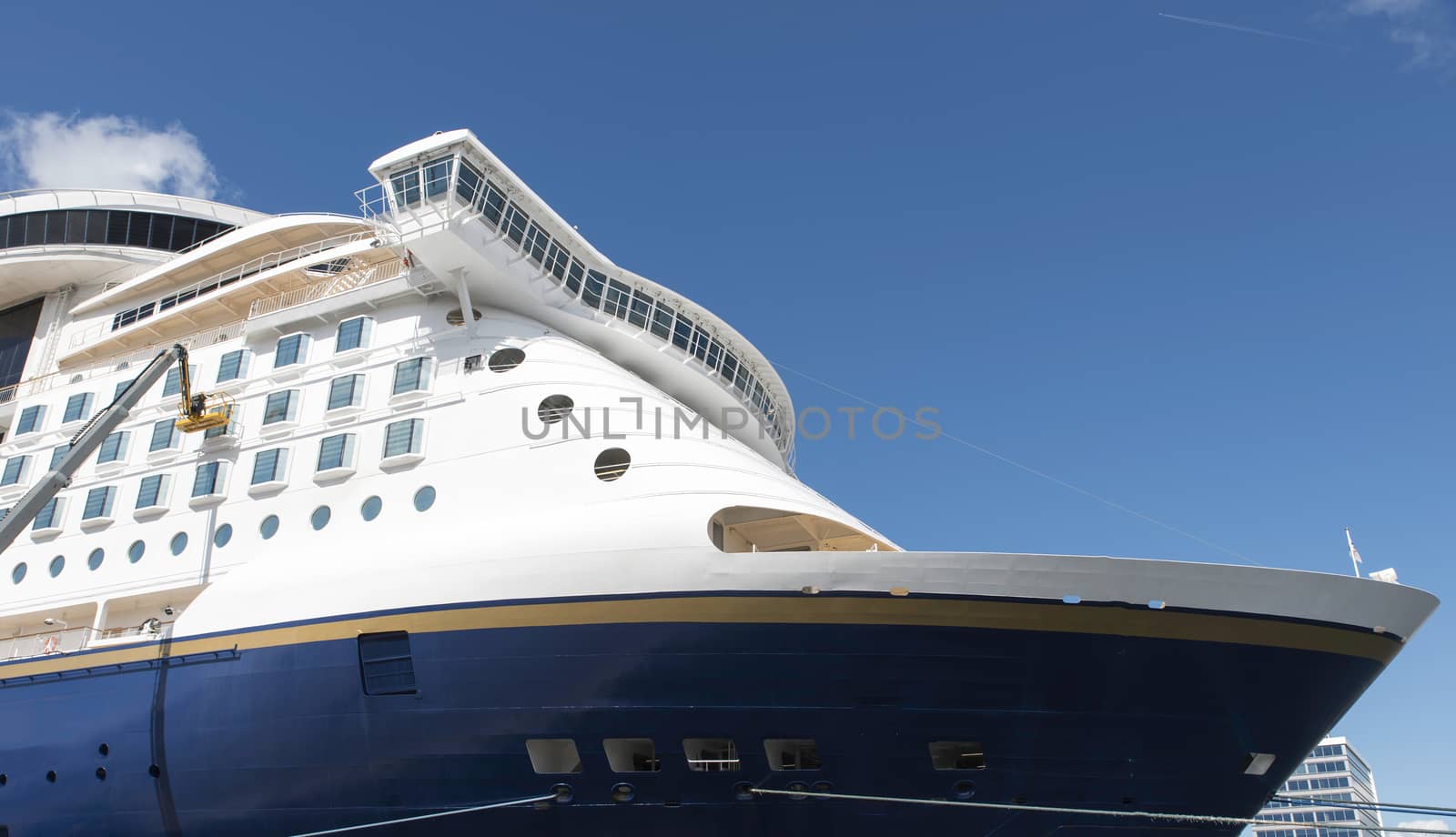 cruiseship with blue sky background waiting in the harbour for the next trip