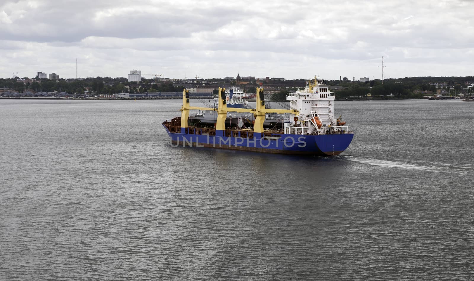 cargo ship leaving the Kiel harbor by compuinfoto