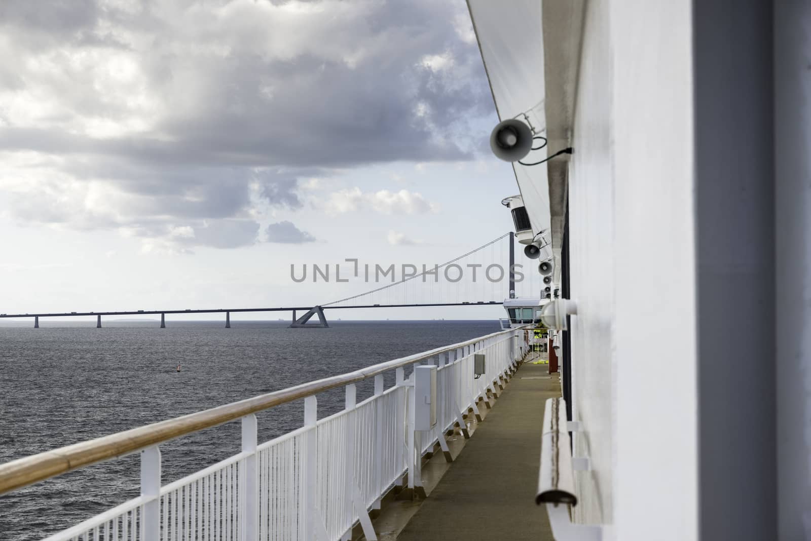 cruise ship crossing the great belt bridge at denmark at the danish islands