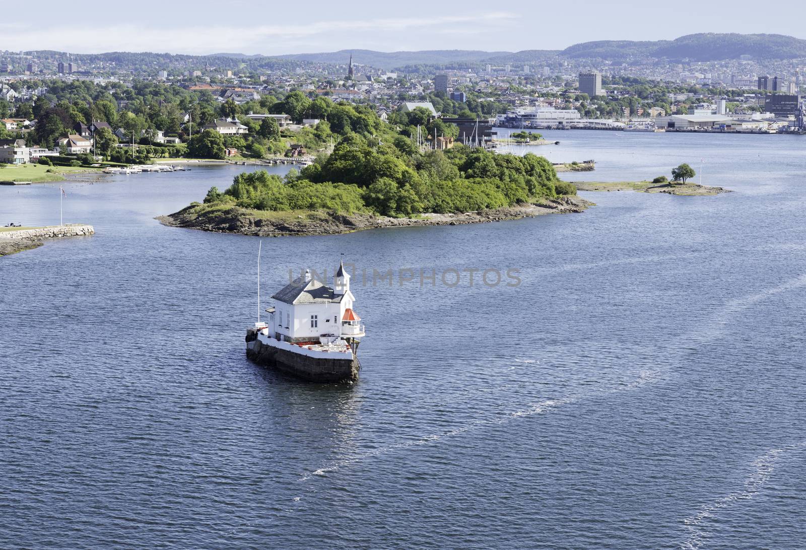 smalli sland with church in the harbor of Oslo norway