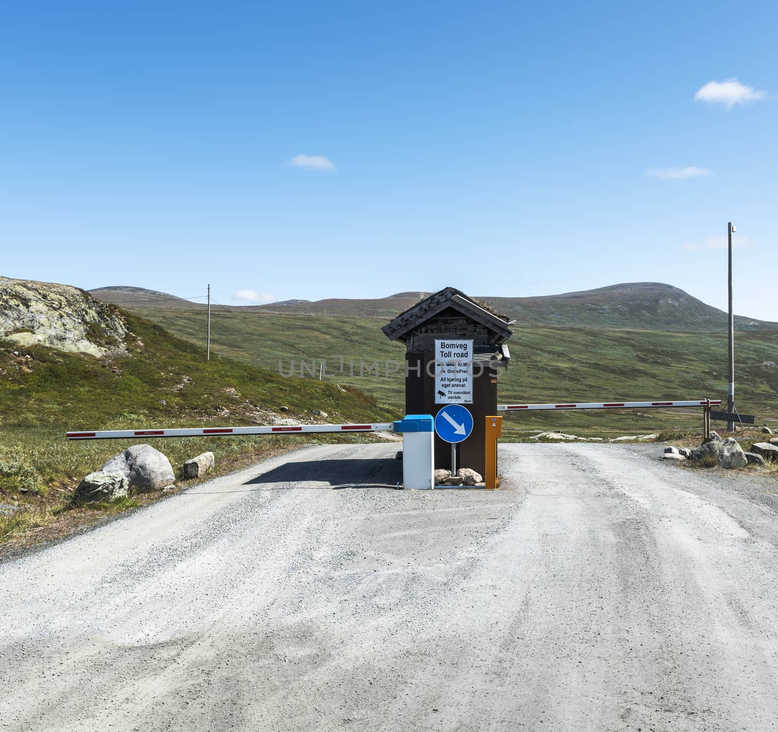 typical norway toll road with place to pay Norwegian crown to open the red and white barrier
