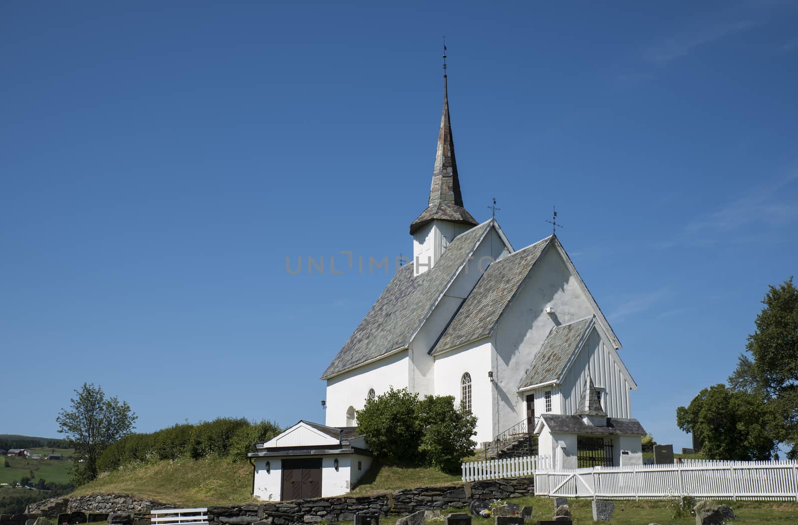 Europe Norway Ulnes  church along lakeshore in central Norway