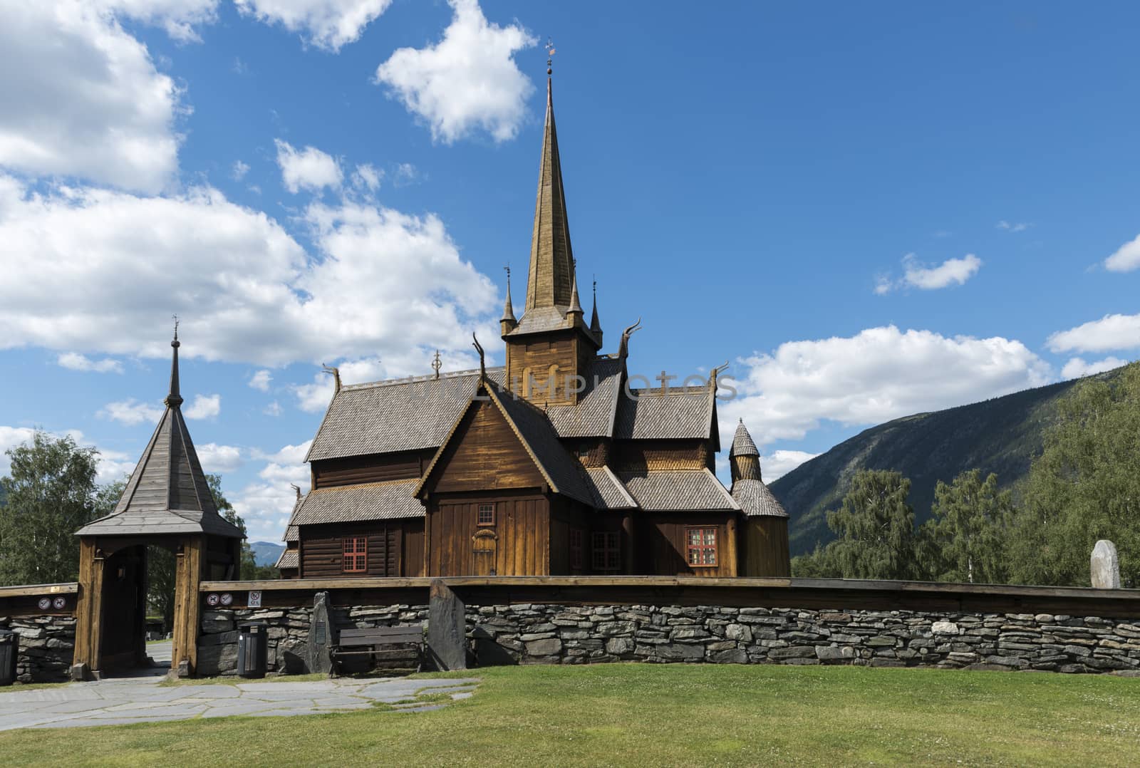 Lom stave church (Lom stavkyrkje) with graveyard foreground, Lom, Norway