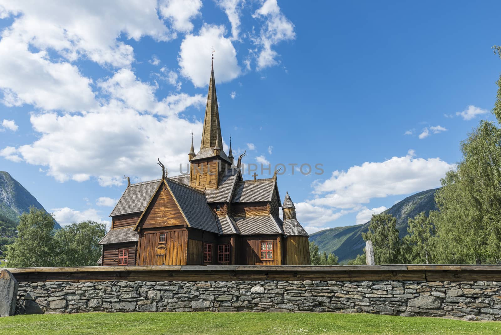 Lom stave church (Lom stavkyrkje) with graveyard foreground, Lom, Norway