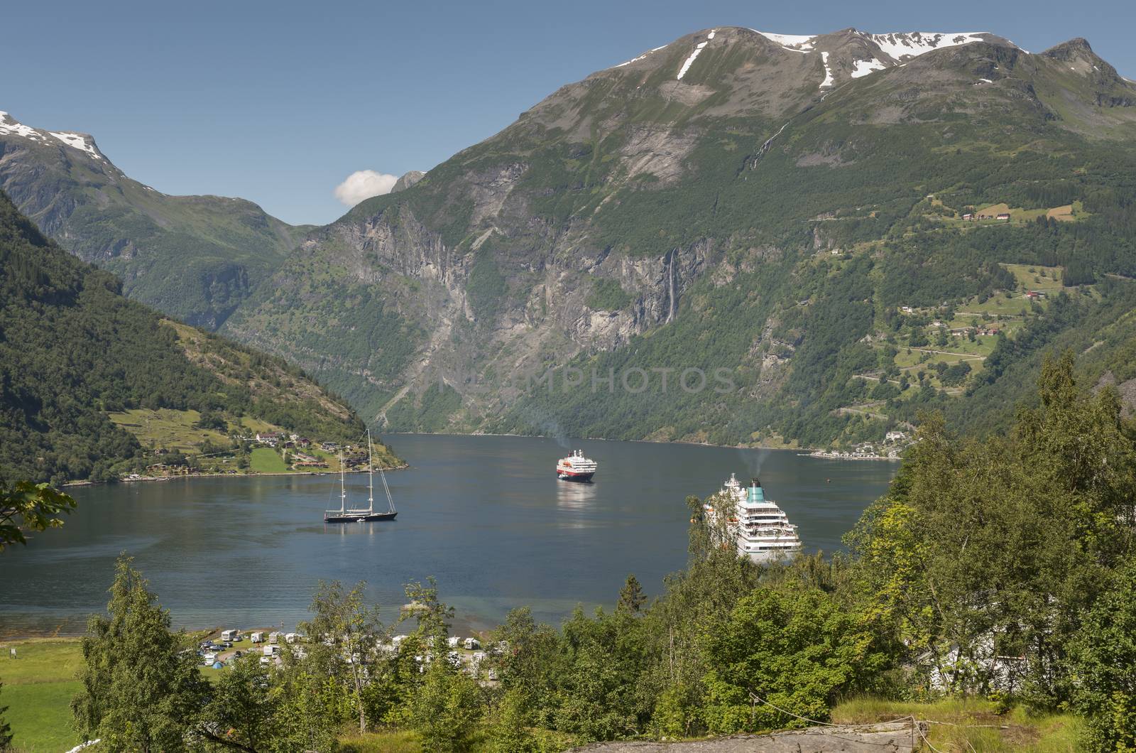 camping sailing boat and cruis ship in the famous geiranger fjord in norway