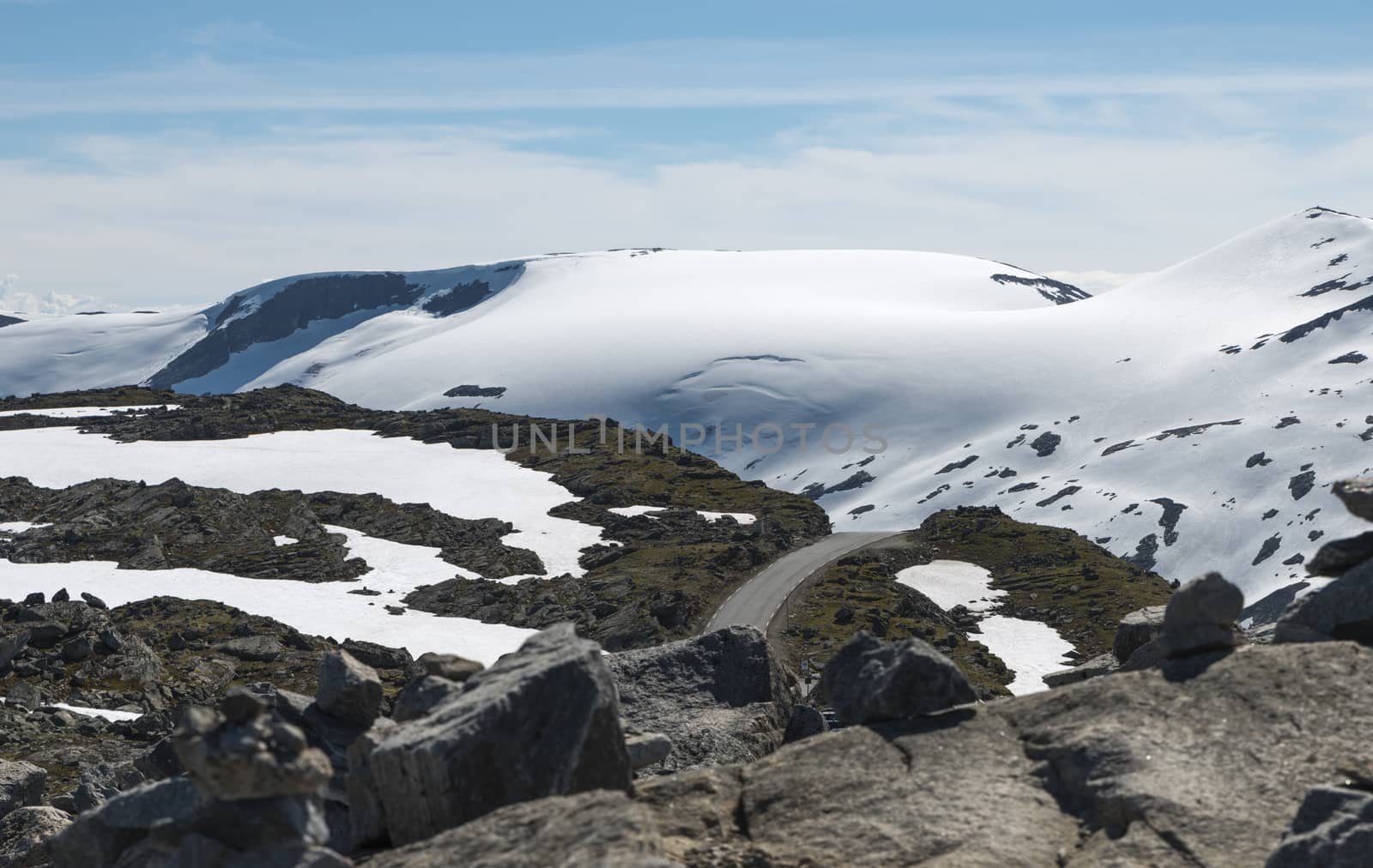 the dalsnibba or road 63 touristic road to the high view of the geirangerfjord in norway with snow in summer on the tops of the mountains