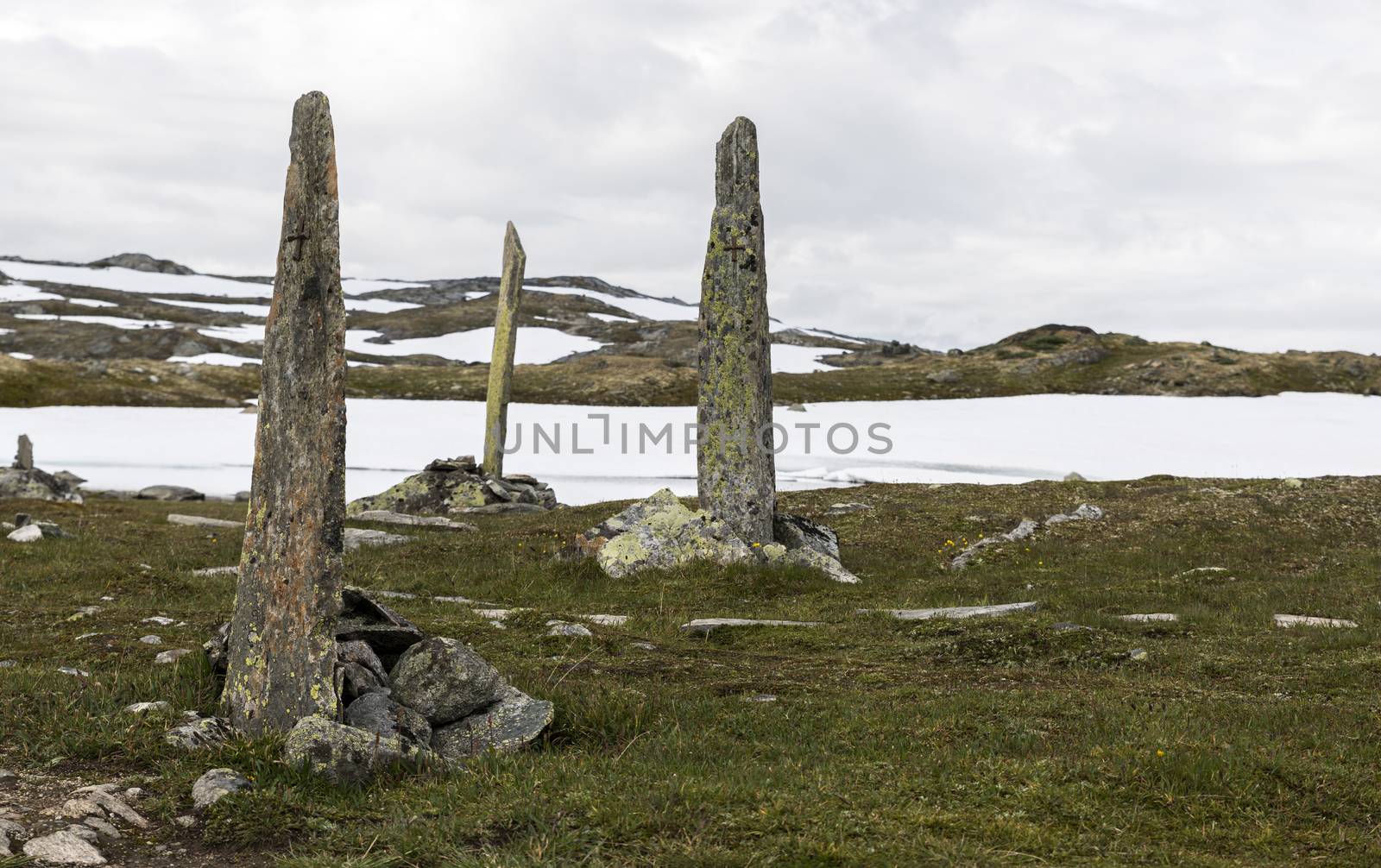 piles of stones as a monument on road 55 where man with horses died by freezing dead when crossing this moutains in 1862