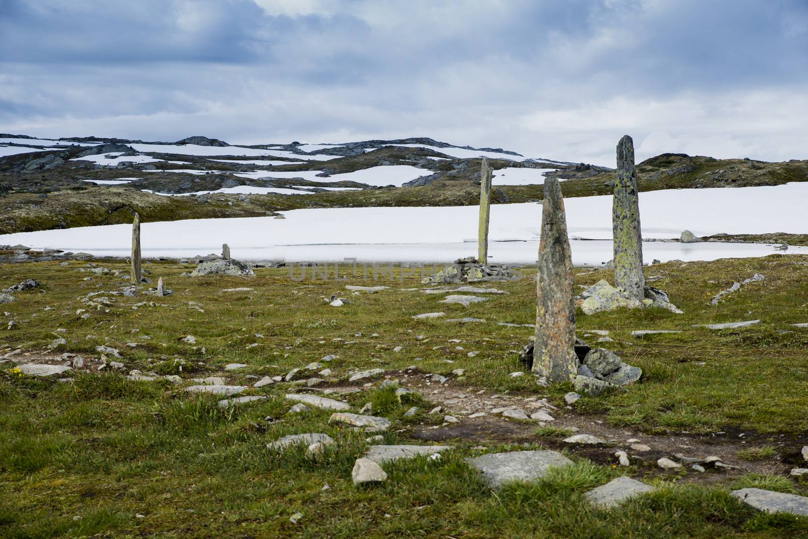 piles of stones as a monument on road 55 where man with horses died by freezing dead when crossing this moutains in 1862