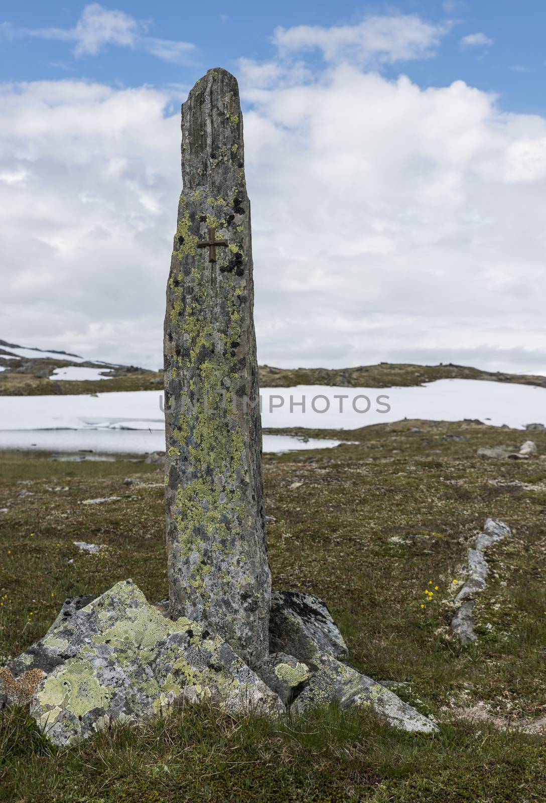 piles of stones as a monument on road 55 where man with horses died by freezing dead when crossing this moutains in 1862