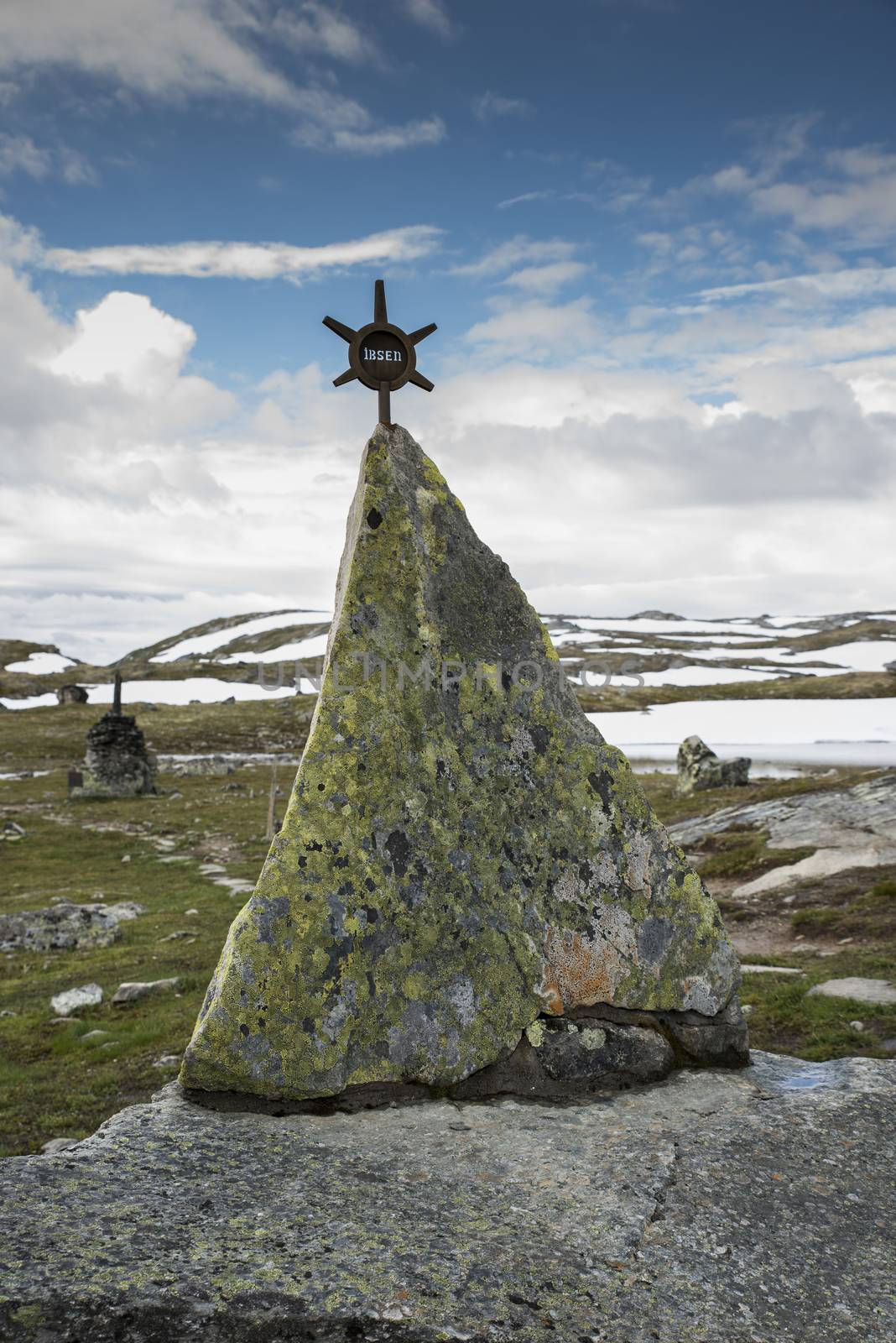 piles of stones as a monument on road 55 where man with horses died by freezing dead when crossing this moutains in 1862