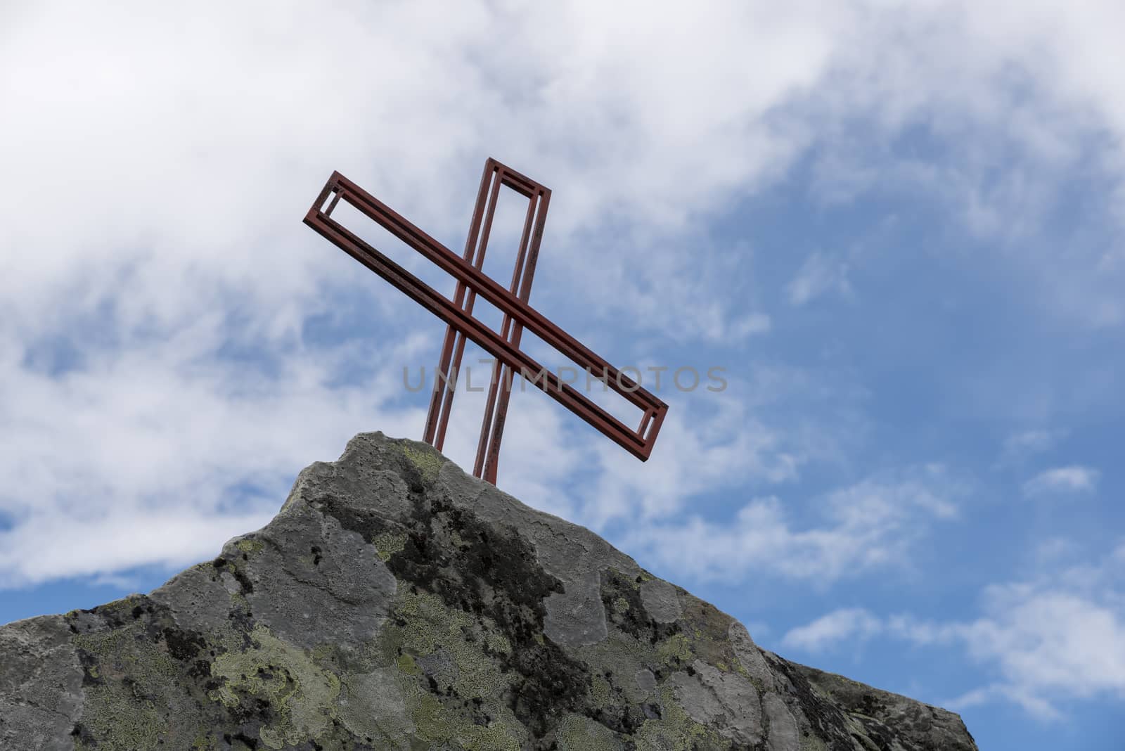 religion cross as monument on a rock in norway