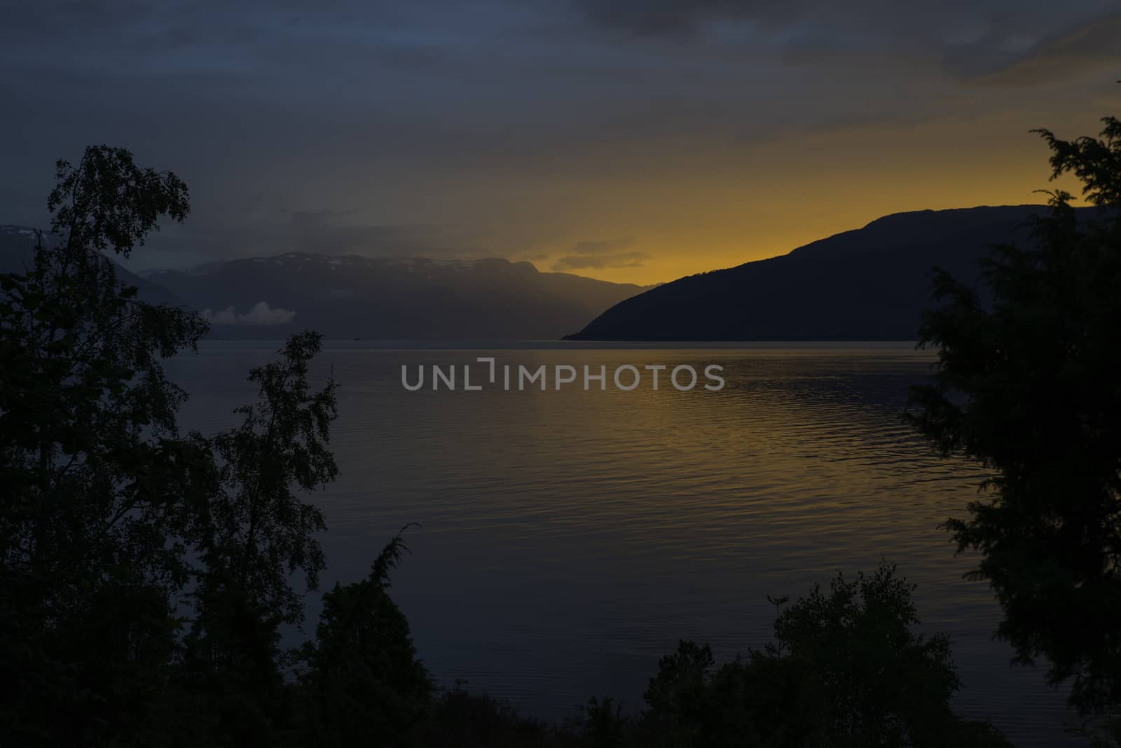 sunset at the sognefjord in norway near the place called Vik