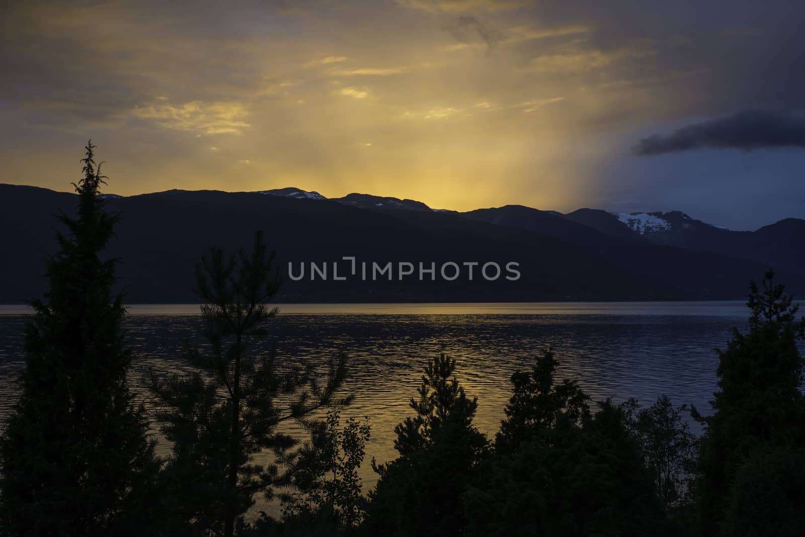 sunset at the sognefjord in norway near the place called Vik
