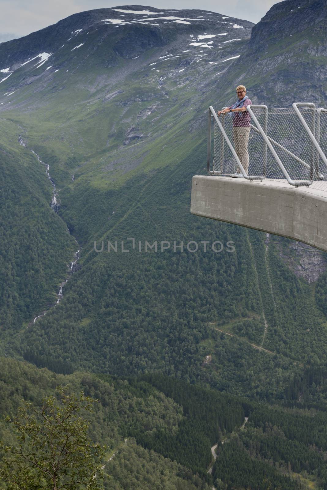 woman on famous viewpoint utiskten near Balestrand in norway