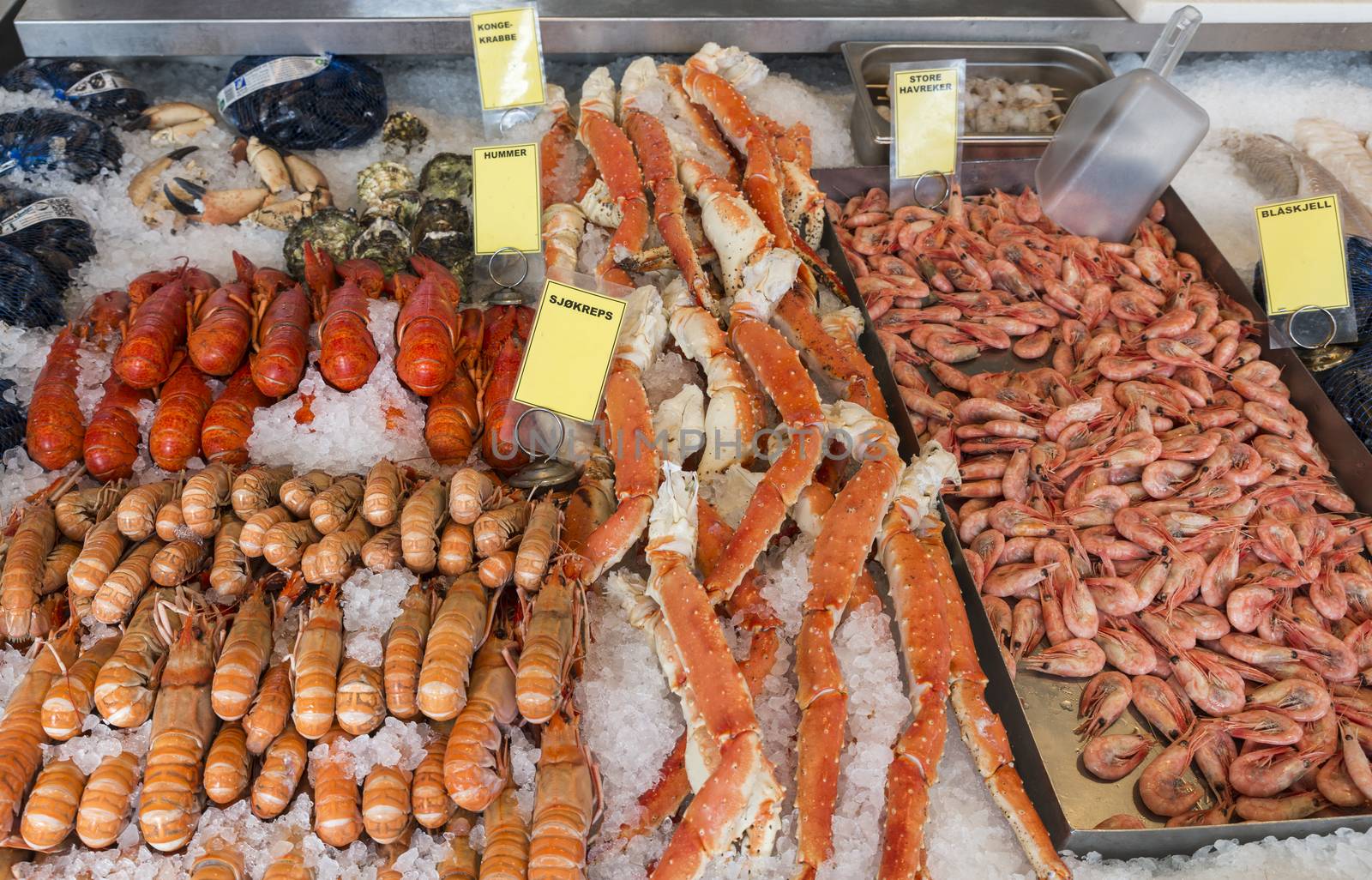 Various seafood on the shelves of the fish market in Norway, Bergen