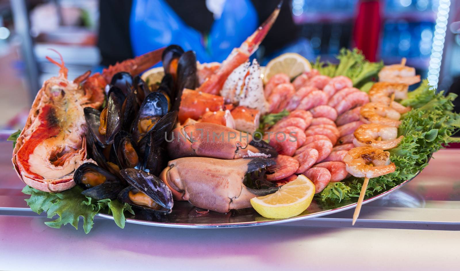 plate with Various seafood on the shelves of the fish market in Norway, Bergen